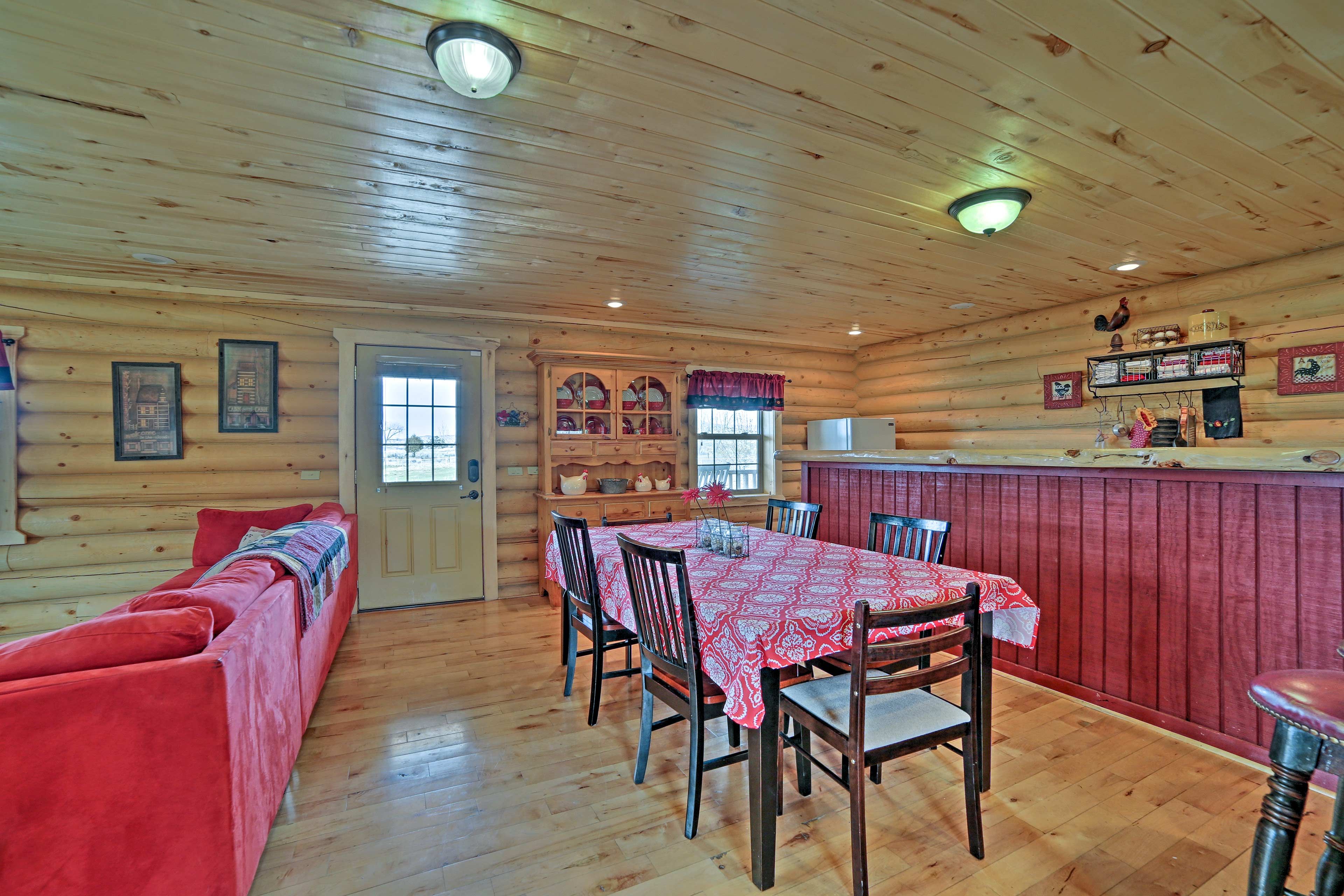 Savor a home-cooked meal at the 6-person hardwood dining table.