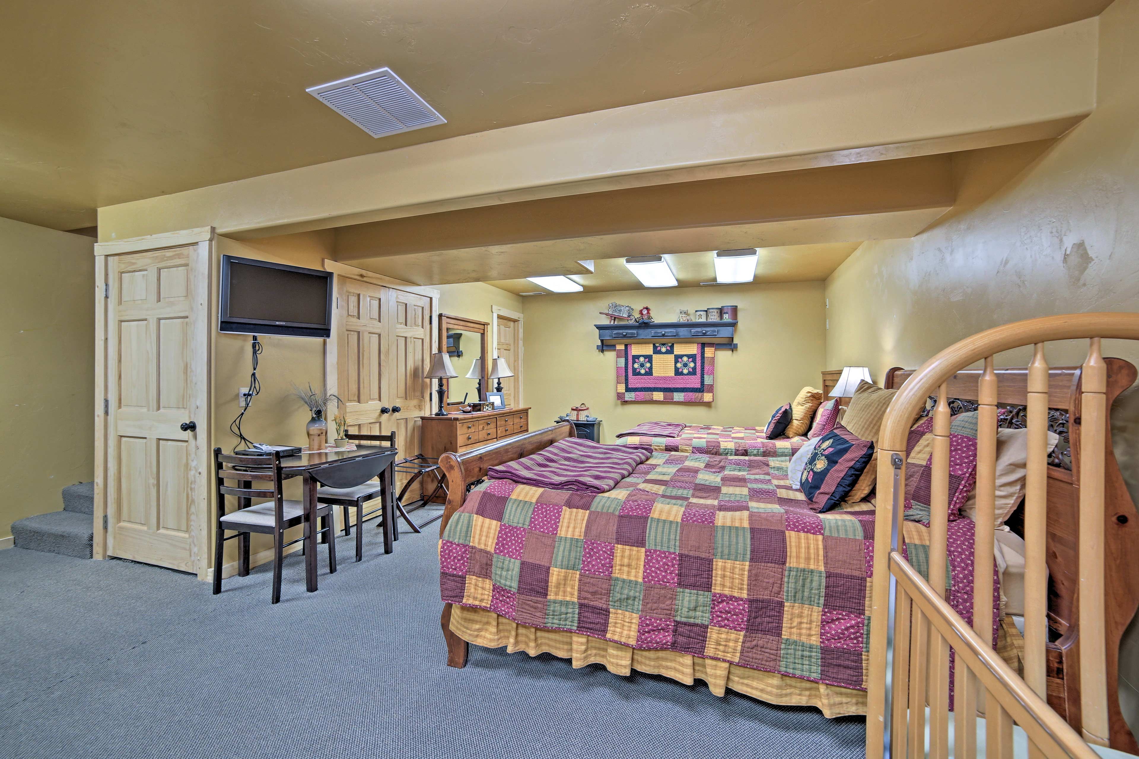Watch a show on the flat-screen satellite TV from comfort of your bed.