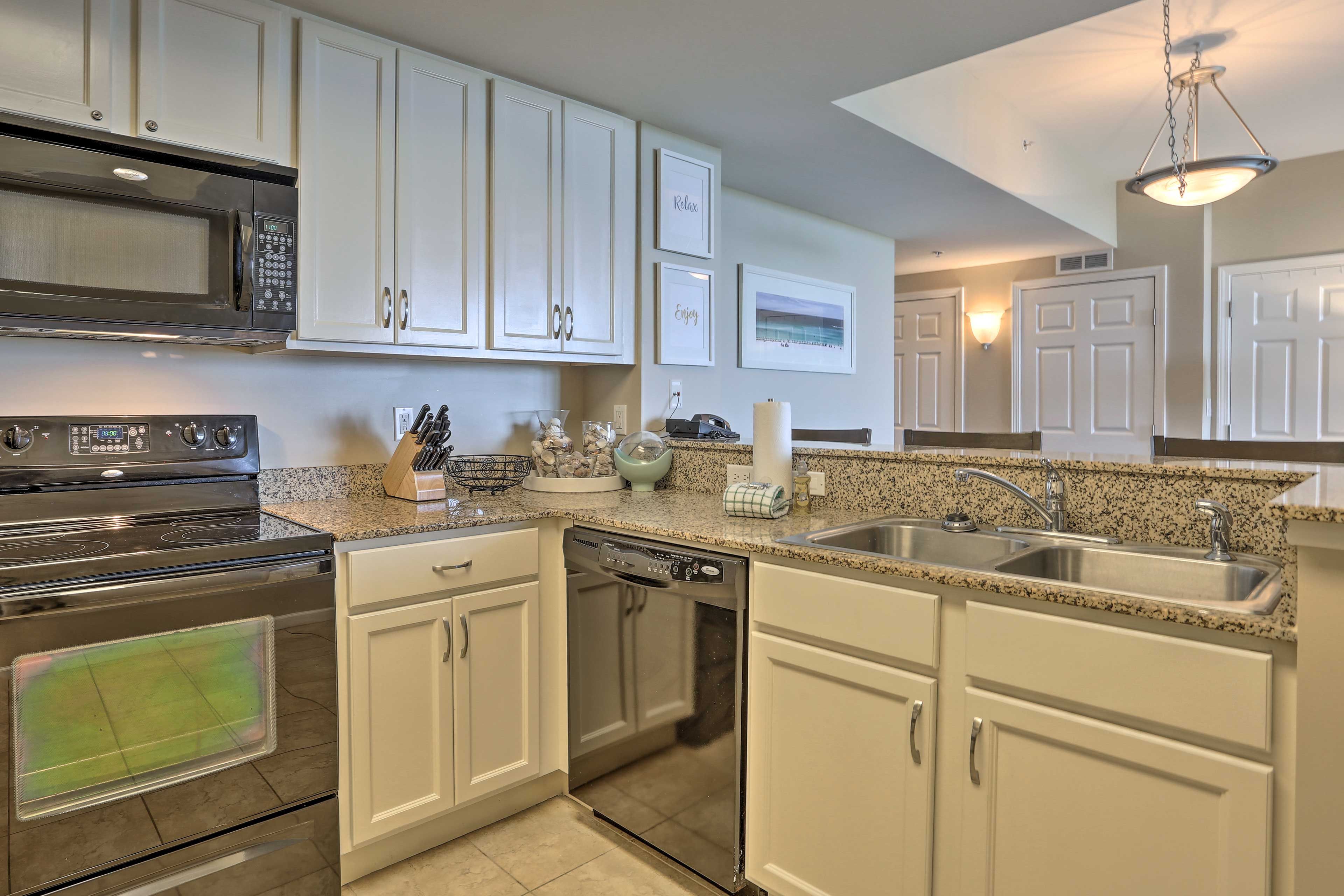 The granite countertops and seashell-filled vases are a lovely touch!