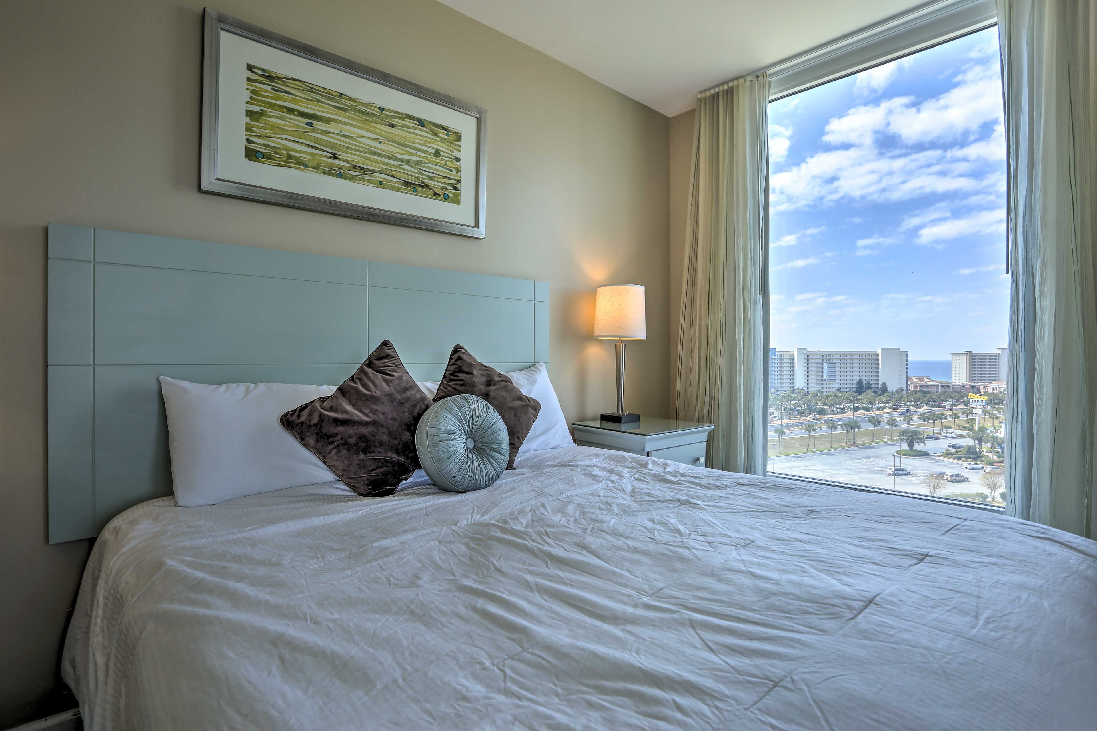 Rise and shine on this cozy king bed in the second bedroom.