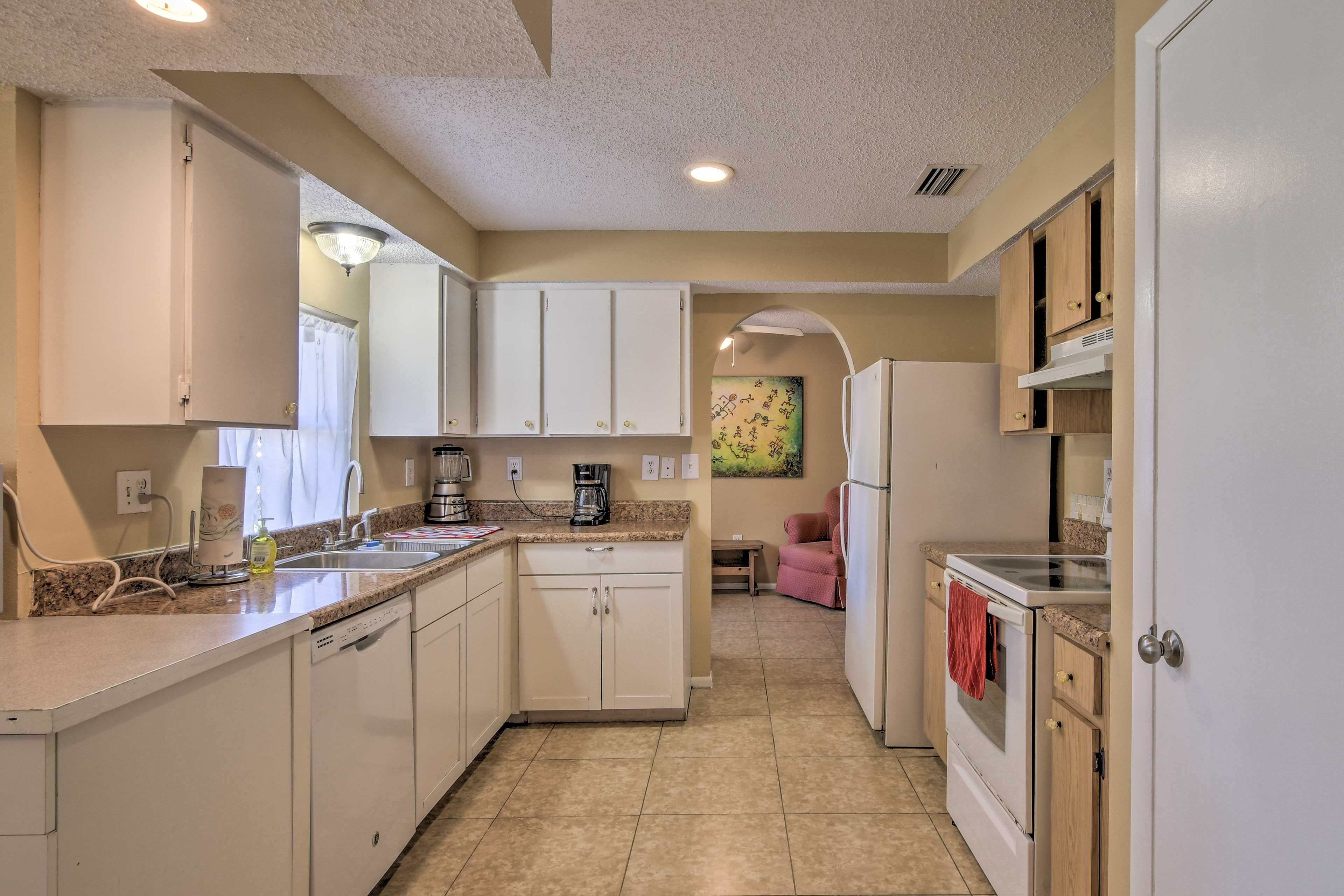 The kitchen comes fully equipped with all of the necessary appliances.
