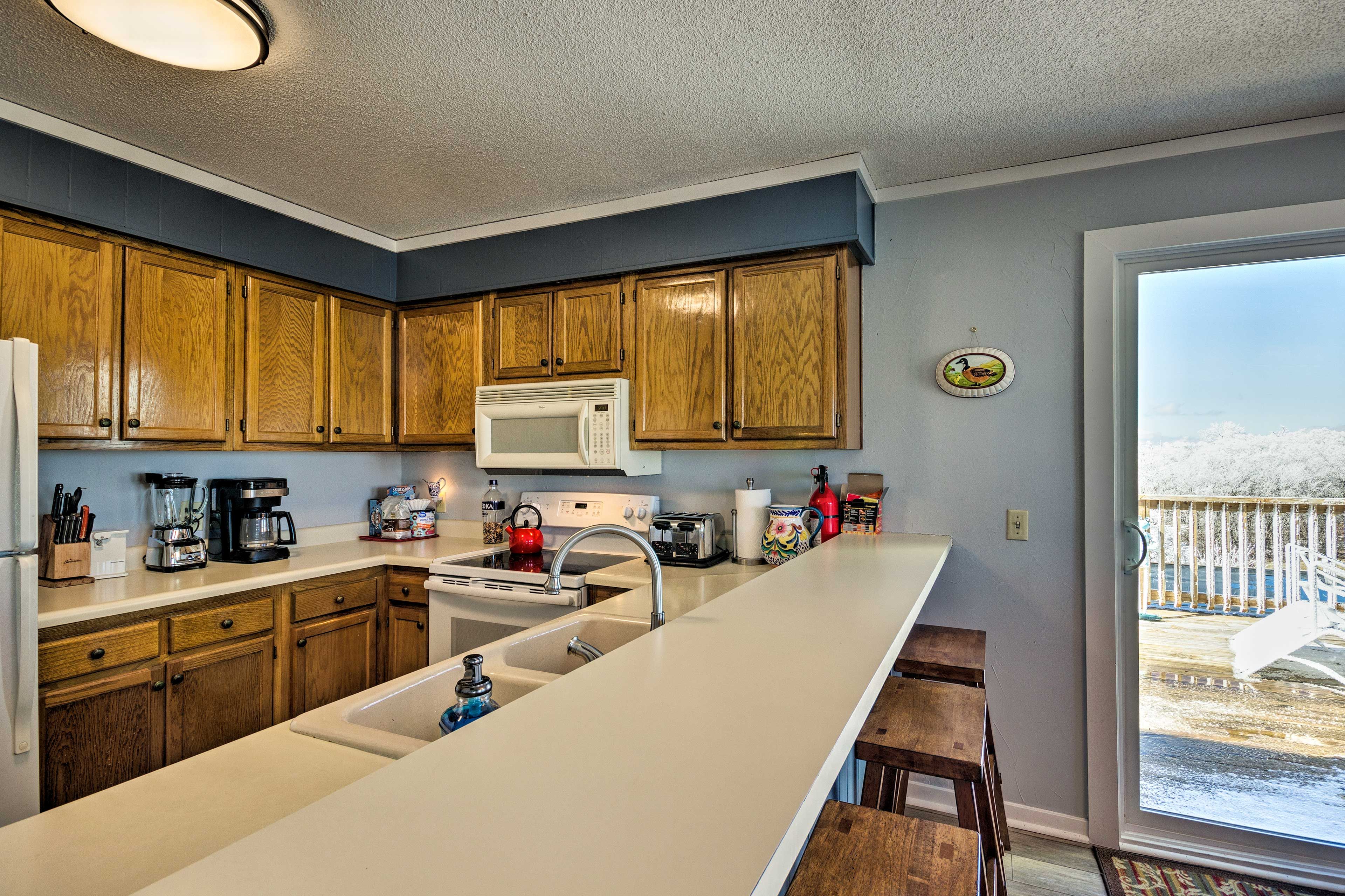 The full kitchen makes cooking a breeze. The coffee maker is now a Keurig.