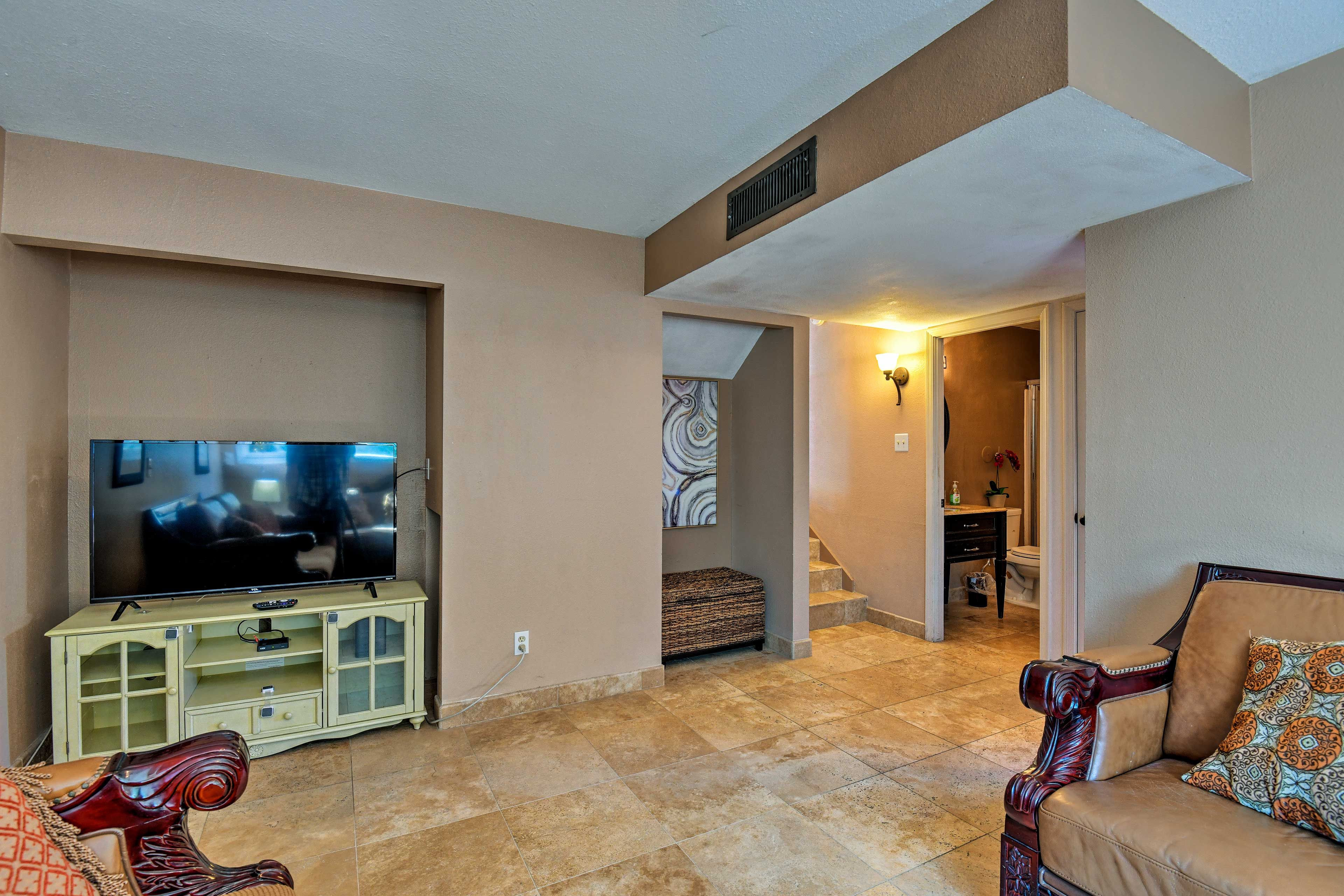 Head downstairs to watch your favorite shows on the flat-screen cable TV.