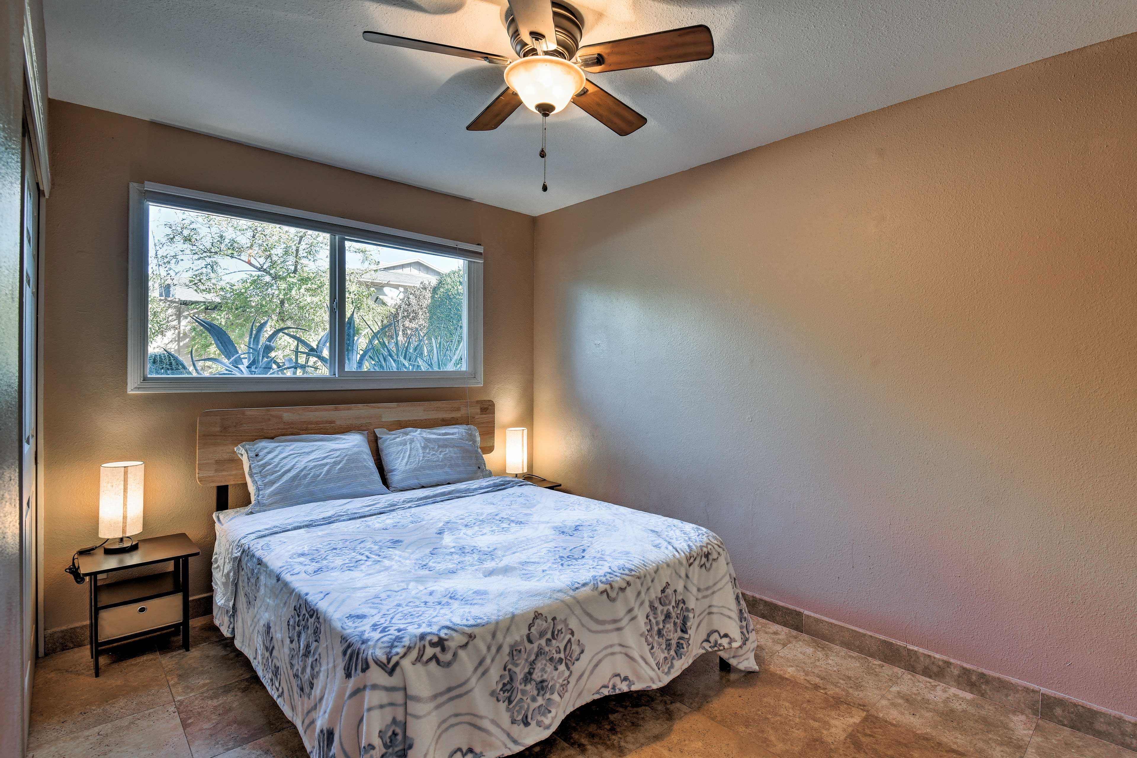 The lower-level bedroom has a queen-sized bed and a closet.