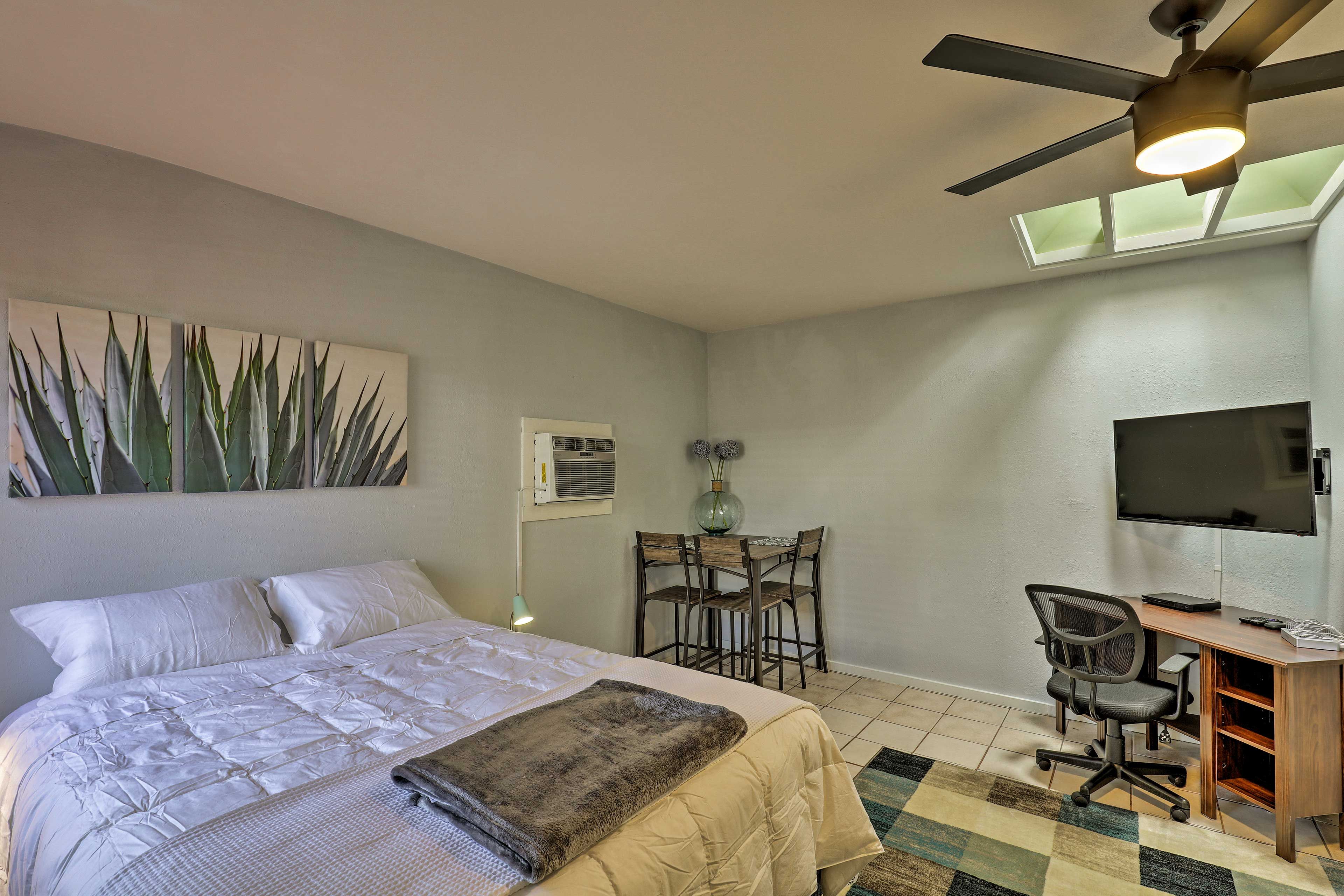 The modern interior boasts a queen bed and full bathroom for 2 guests.