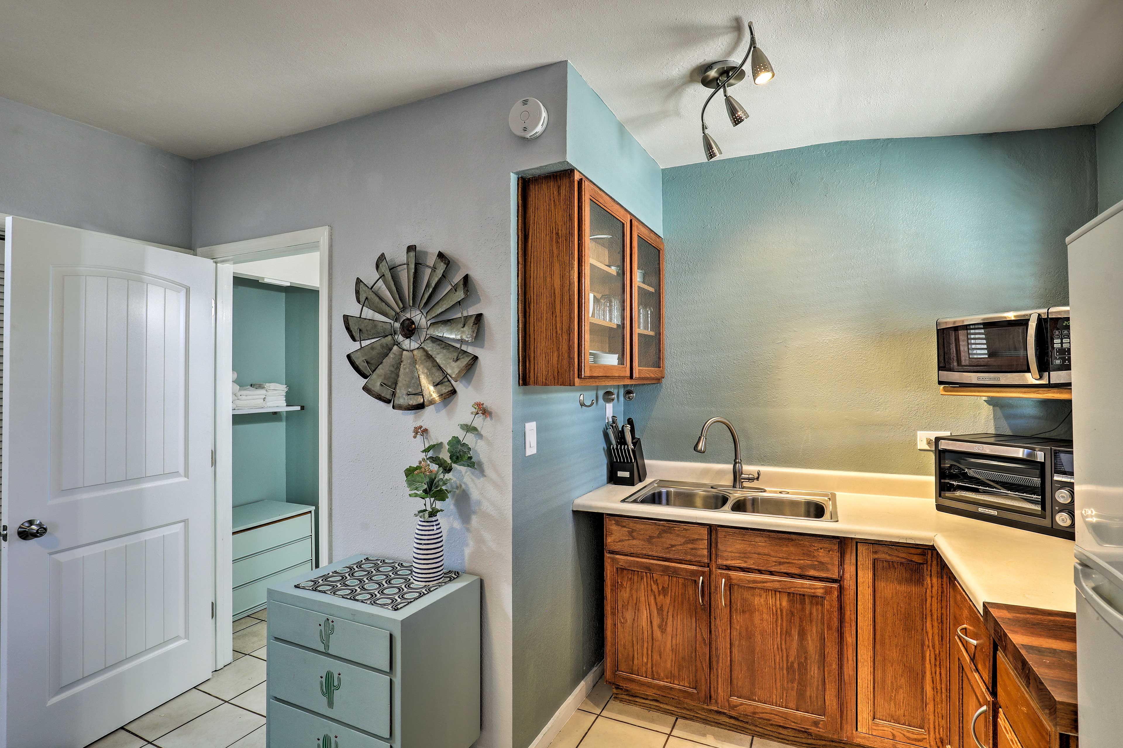 The bright, modern interior features a well-equipped kitchenette.