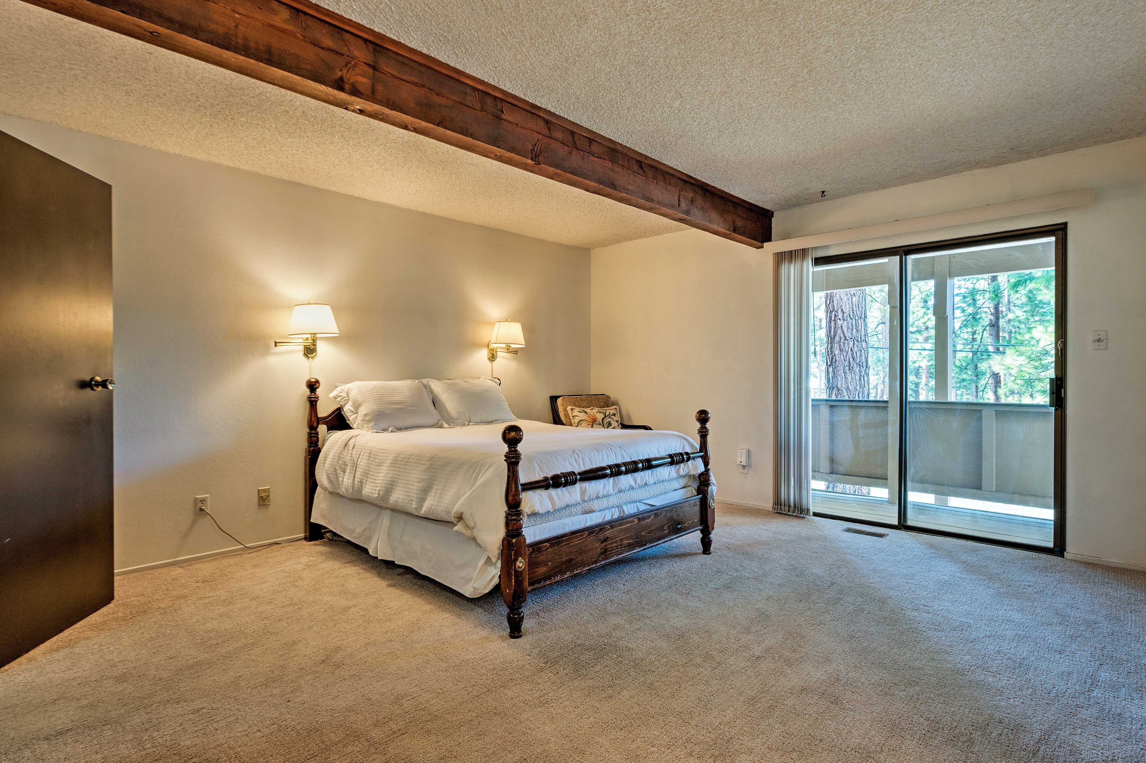 This bedroom boasts a queen bed and access to the deck.