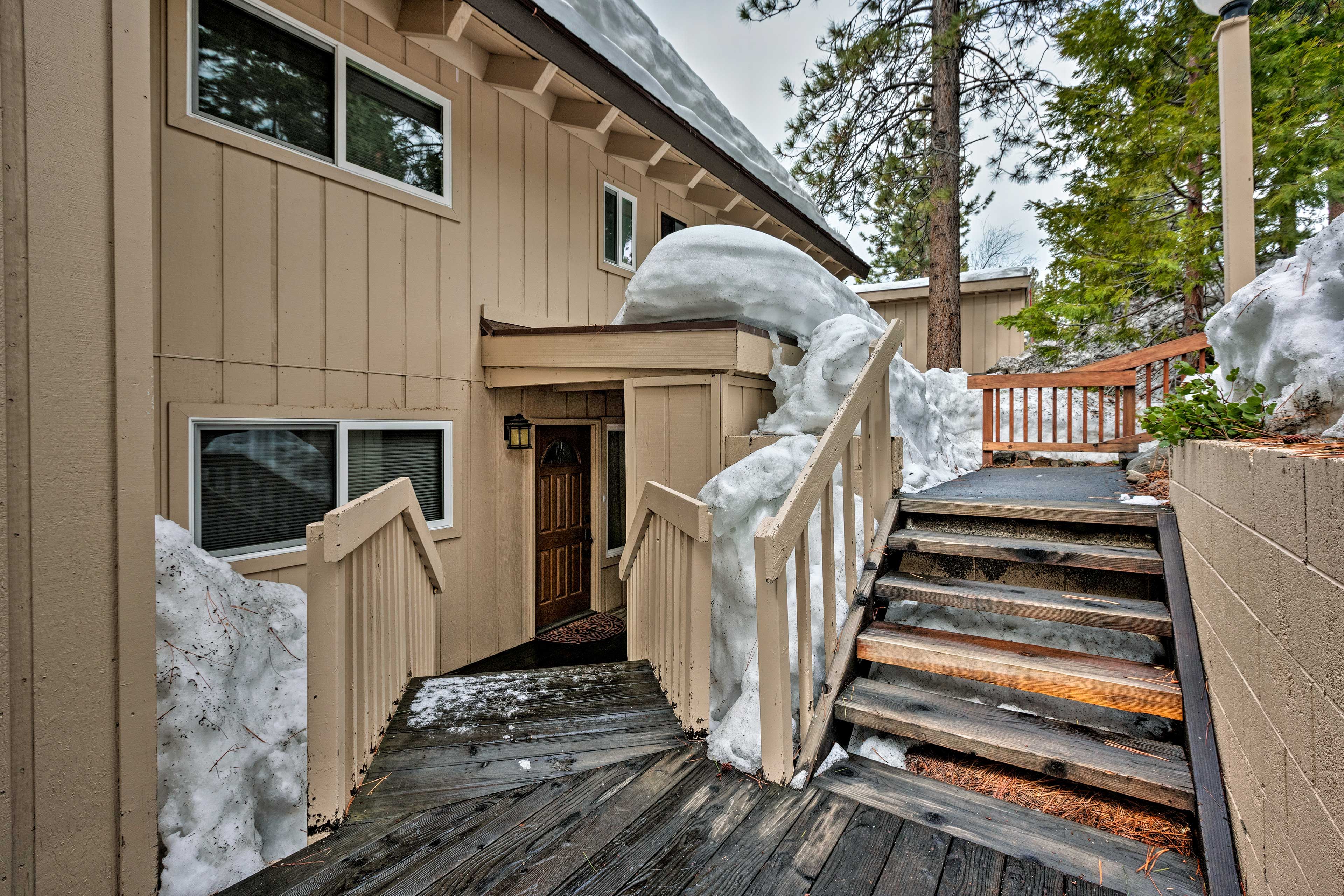 There are steps leading to the townhome.