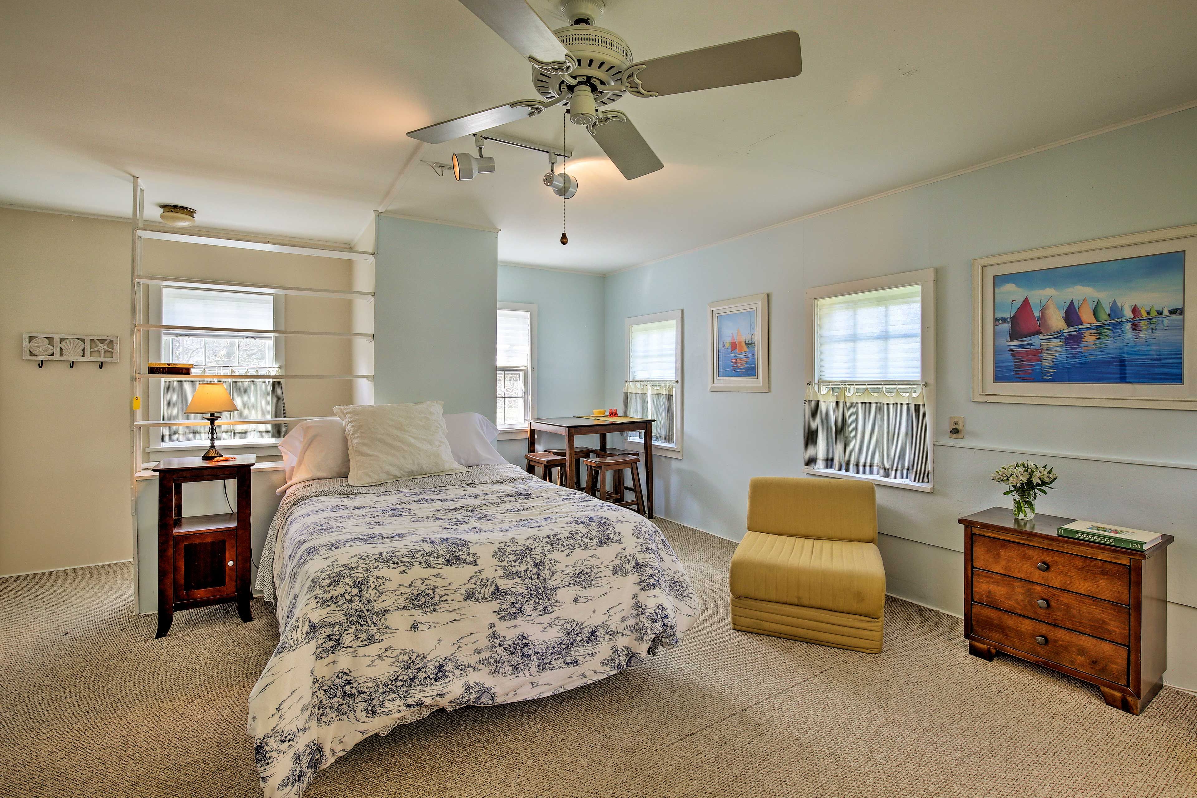 Drift to sleep in the queen bed, or sip some wine at the corner table.