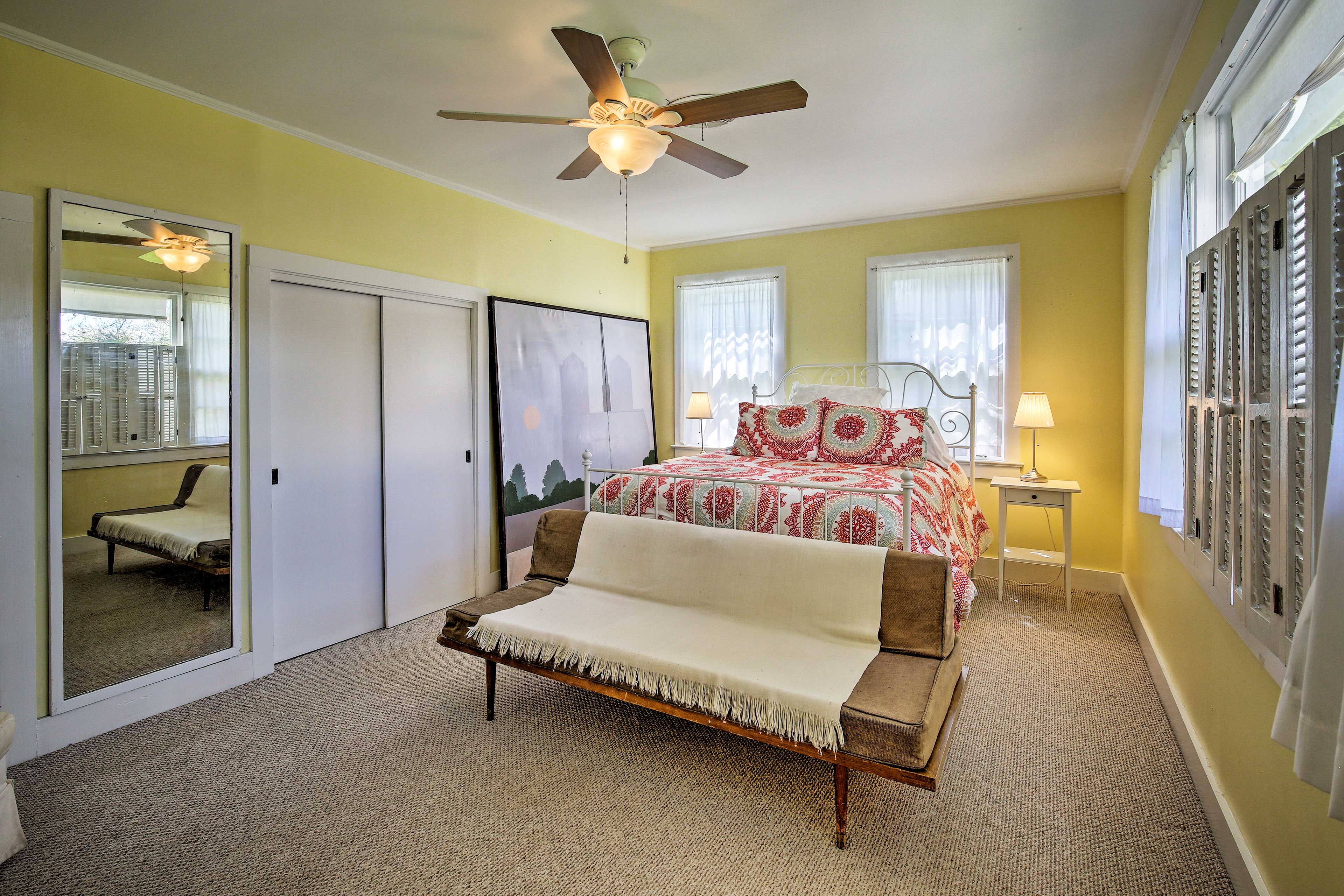 The Yellow Bedroom hosts a queen bed and a futon for 4 guests.