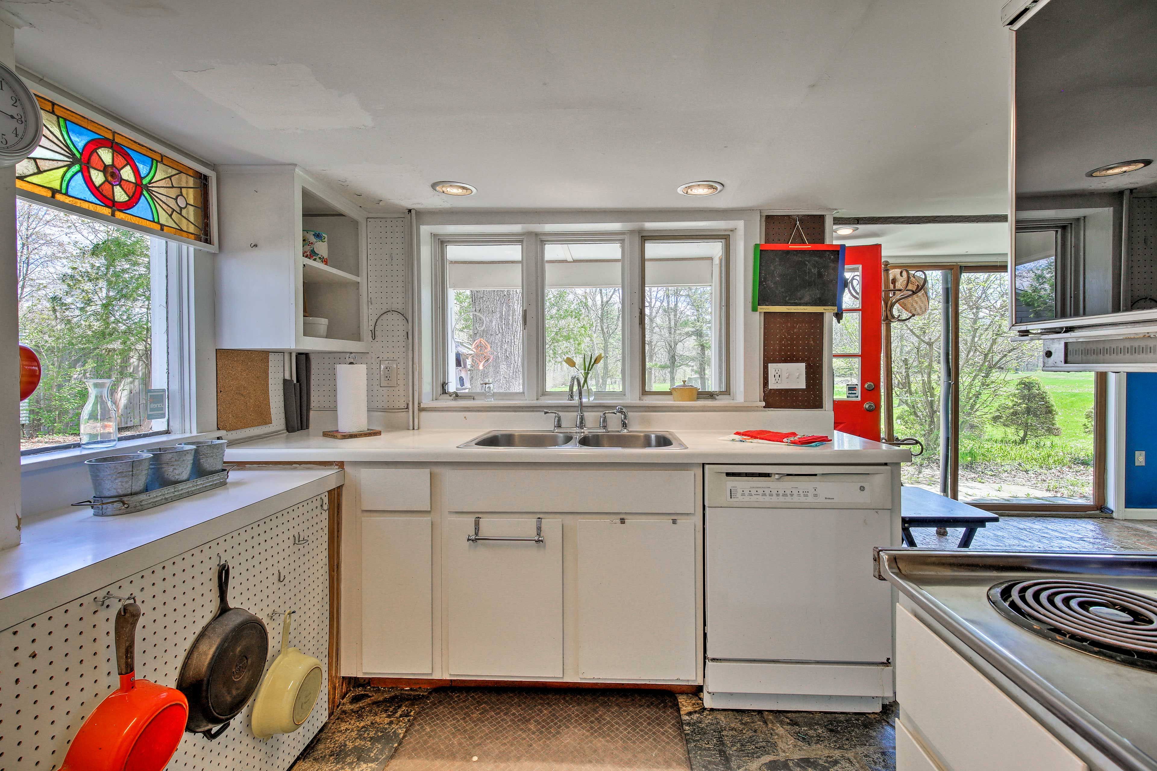 Pops of color accent the crisp white cabinets.