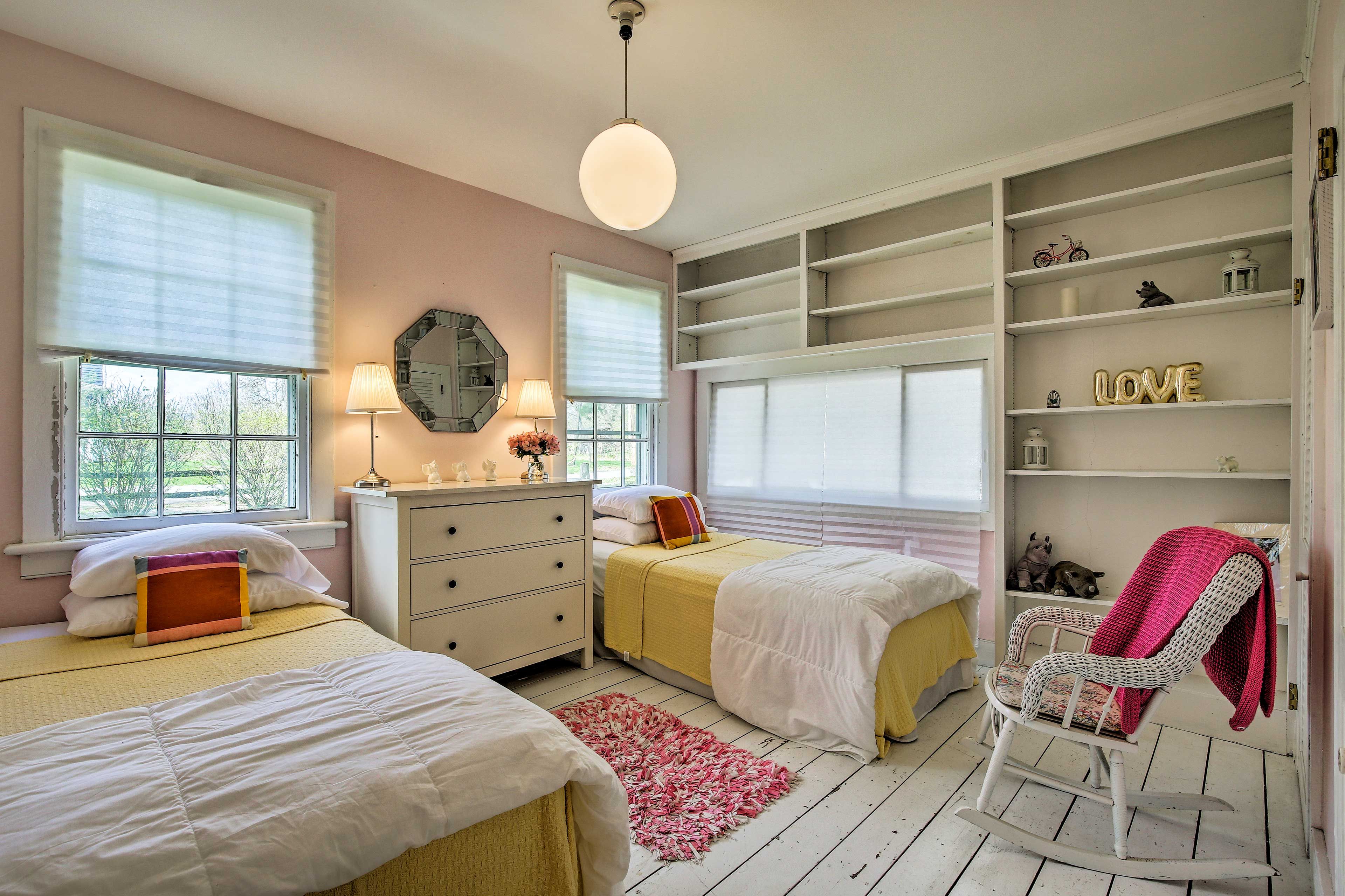 Sweet style defines The Pink Room, which also boasts built-in shelves.