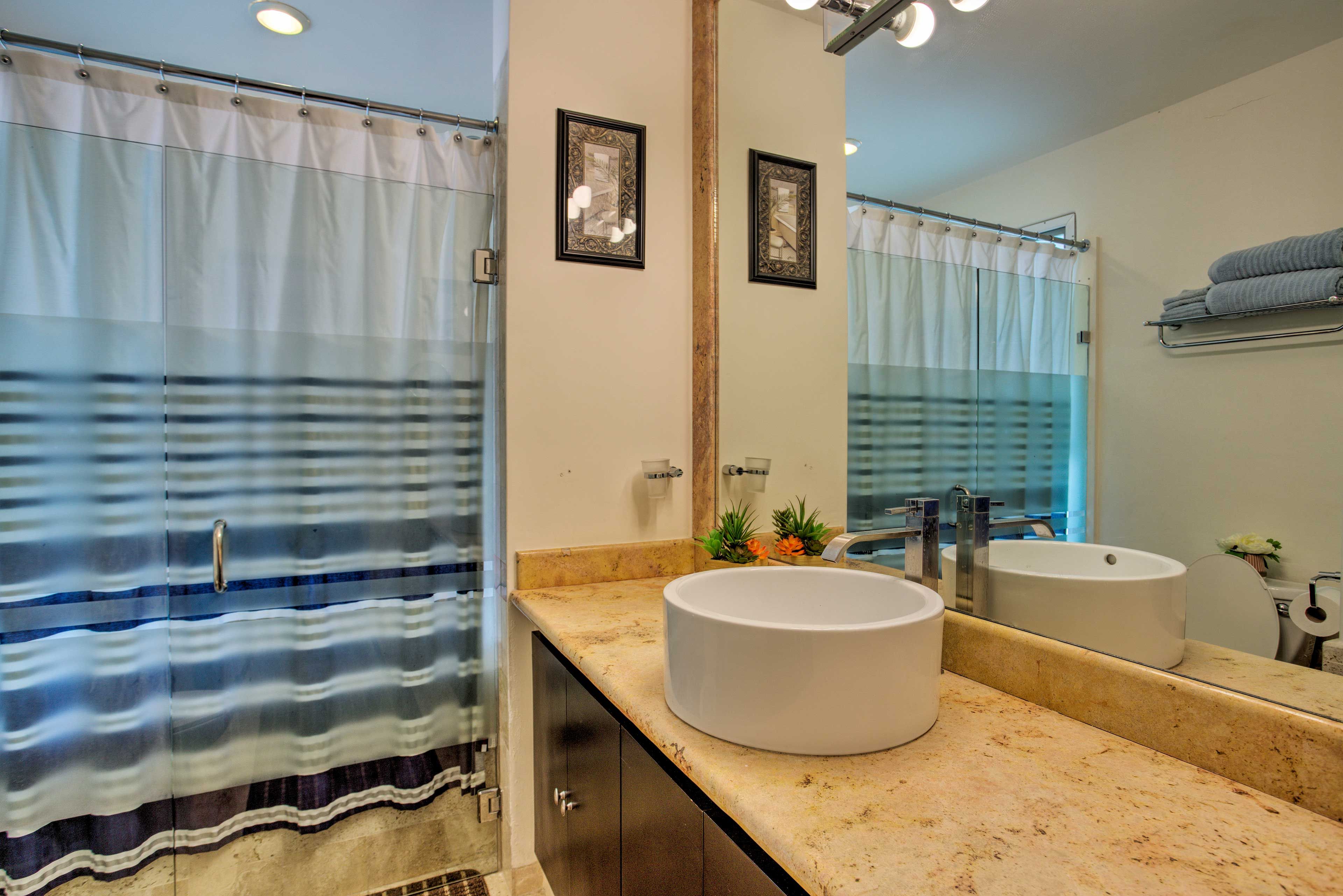 This condo has 3 pristine bathrooms.