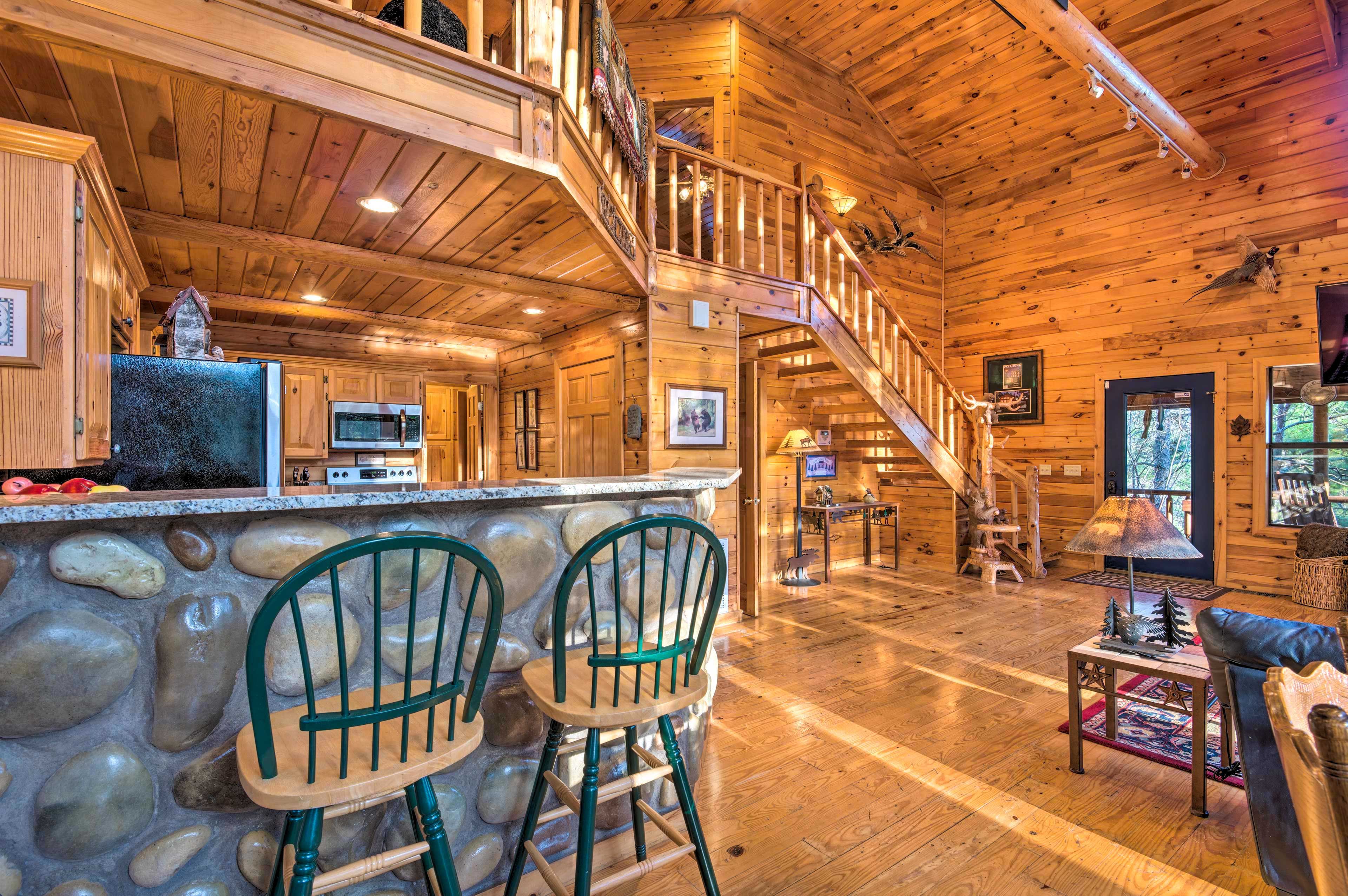 The fully equipped kitchen is steps from the living area.