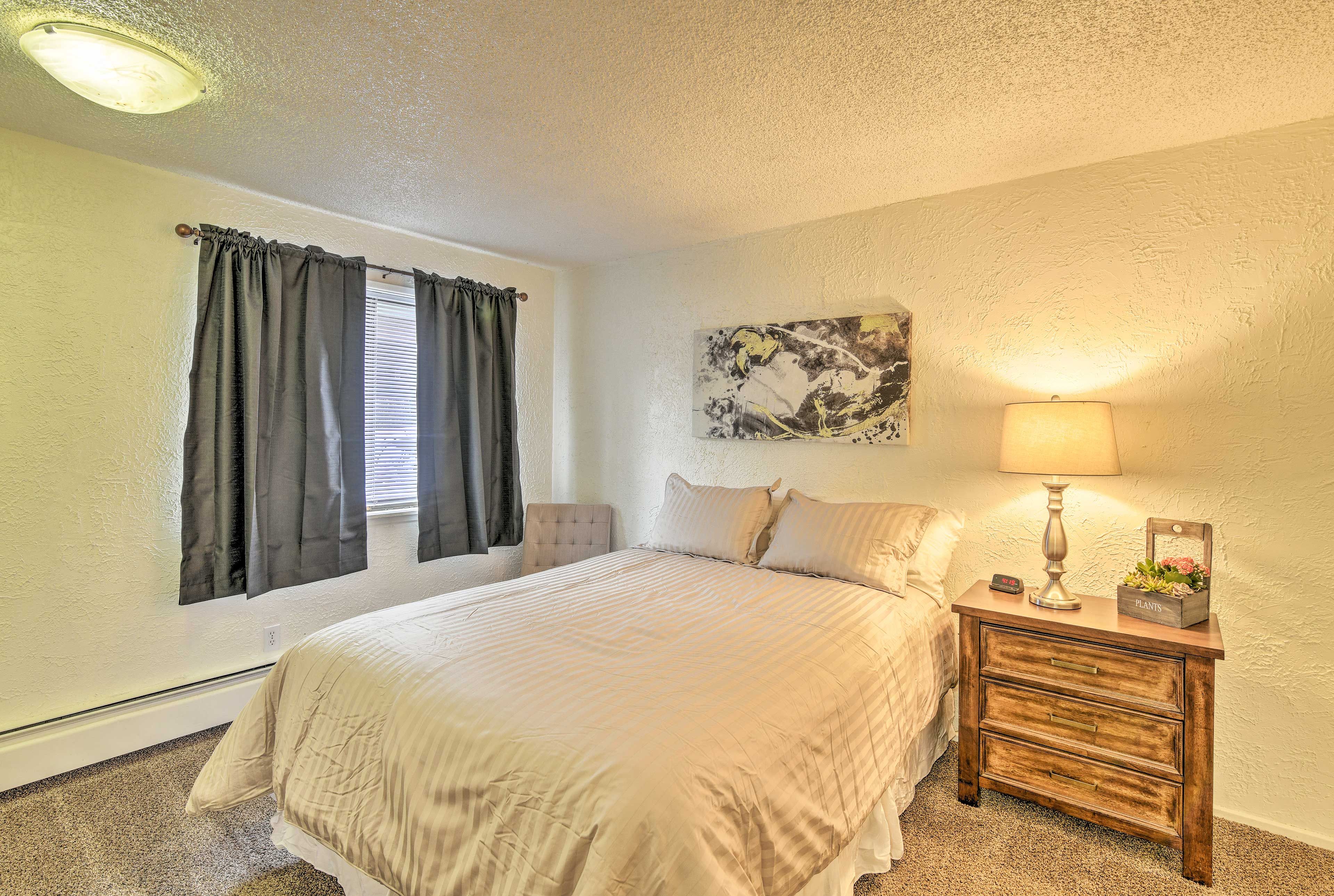 Retreat to this queen-sized bed at night.