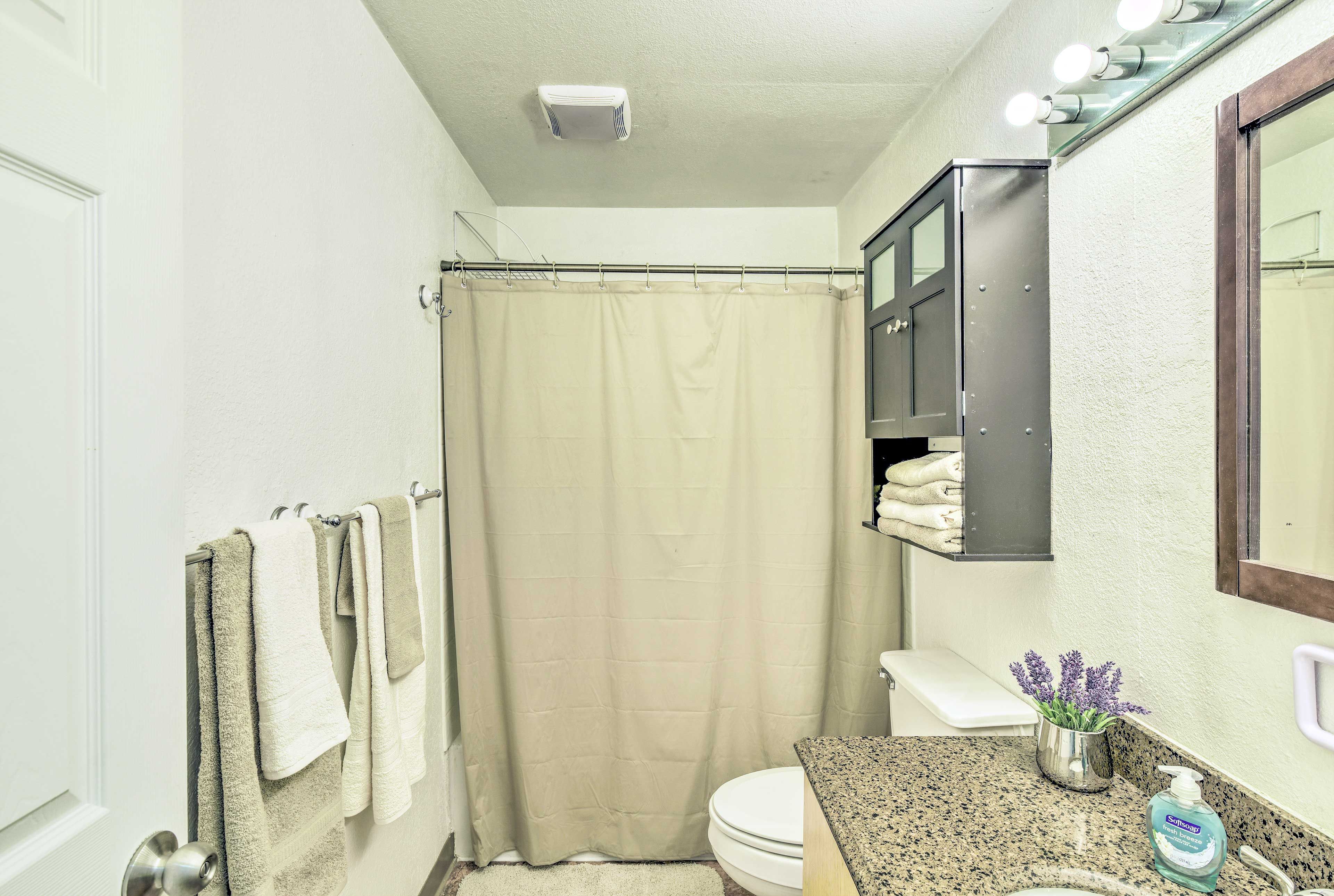 Prep for the day in the pristine full bath.