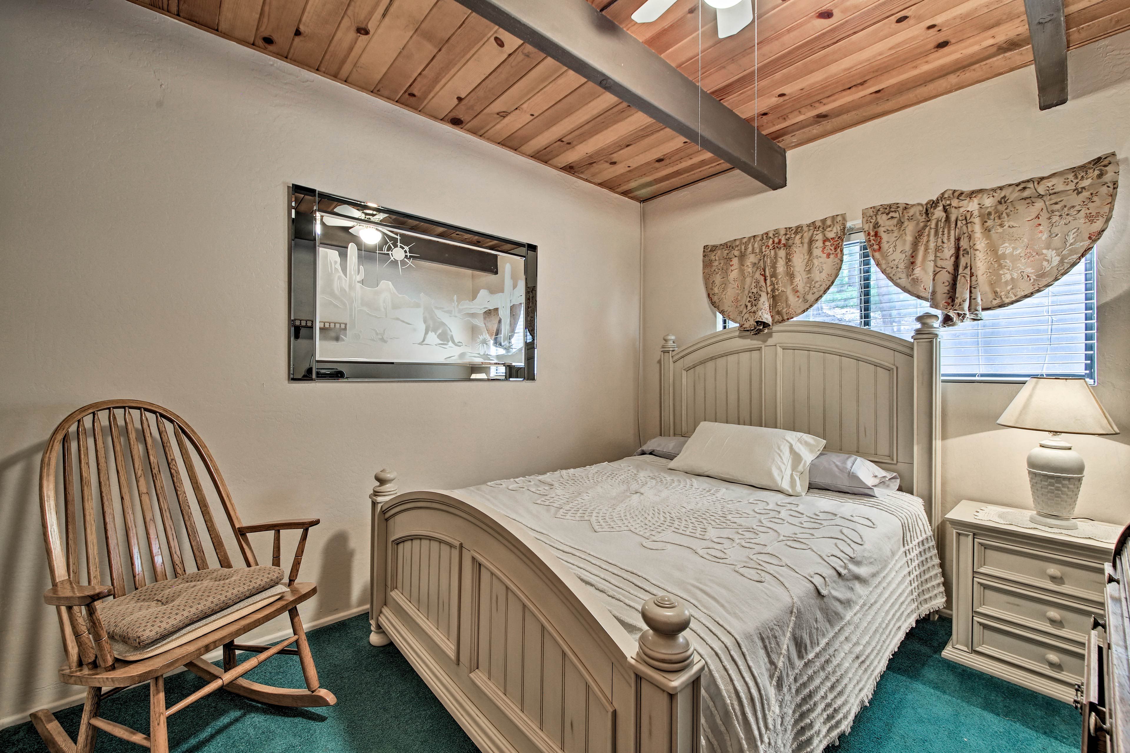 Curl up on this queen bed for a peaceful night of rest.