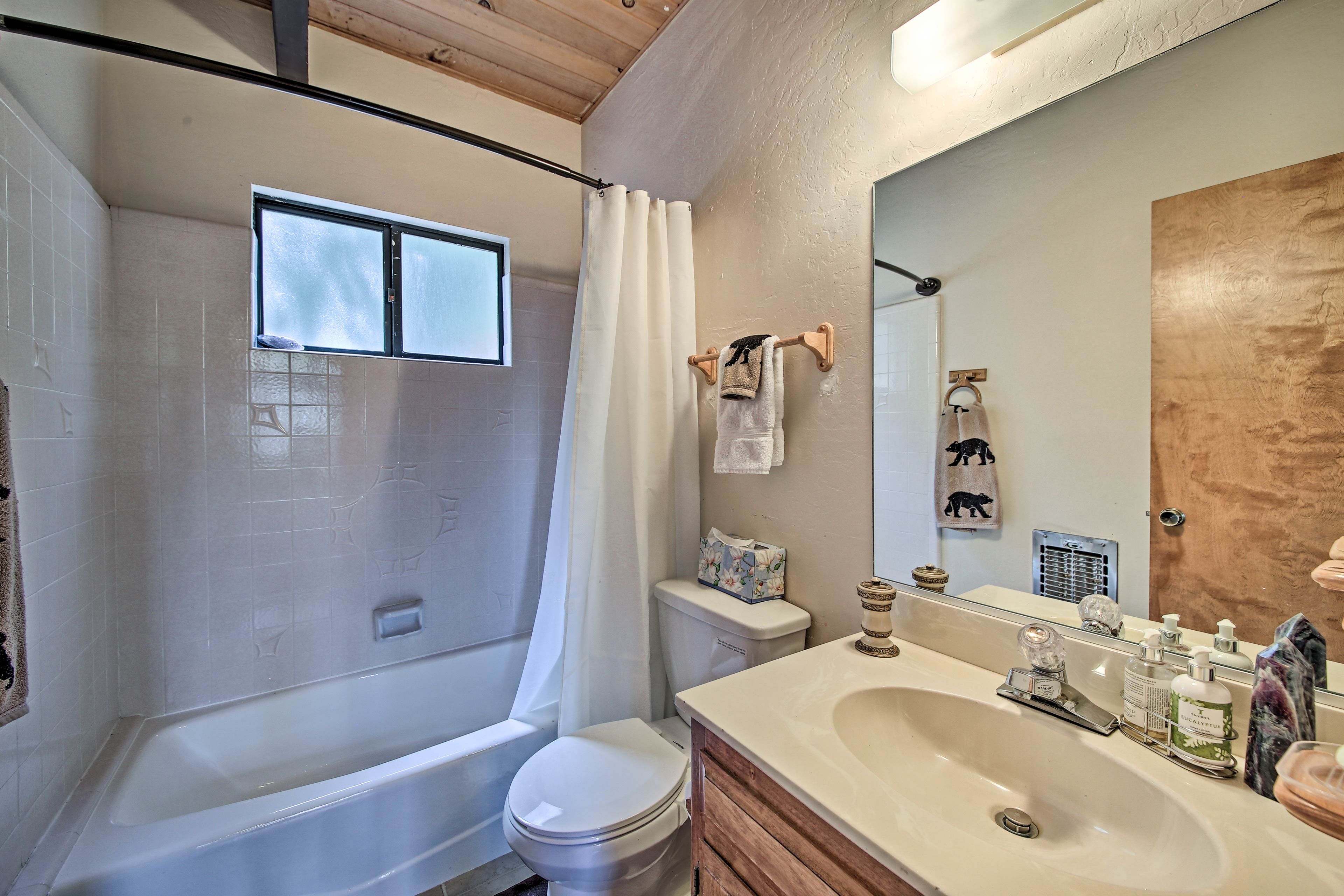 A shower/tub combo highlights this bathroom.