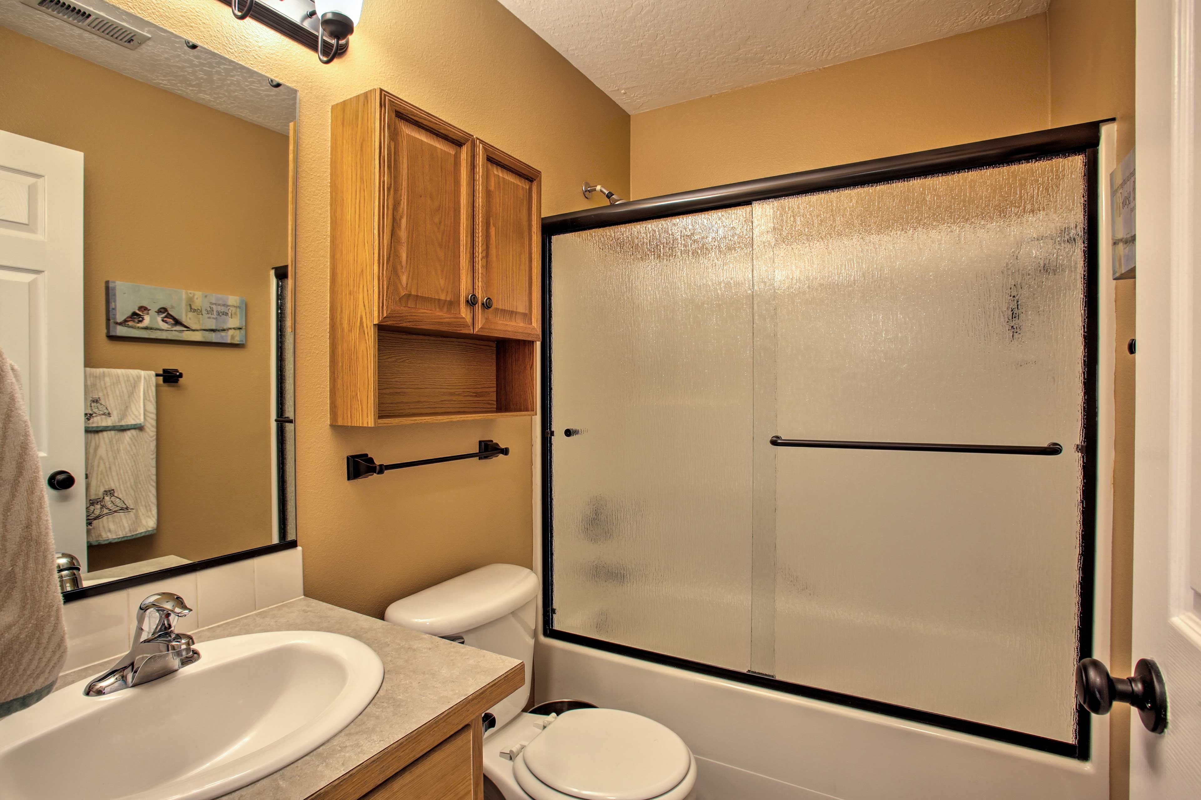 The second bathroom also includes a shower/tub combo.