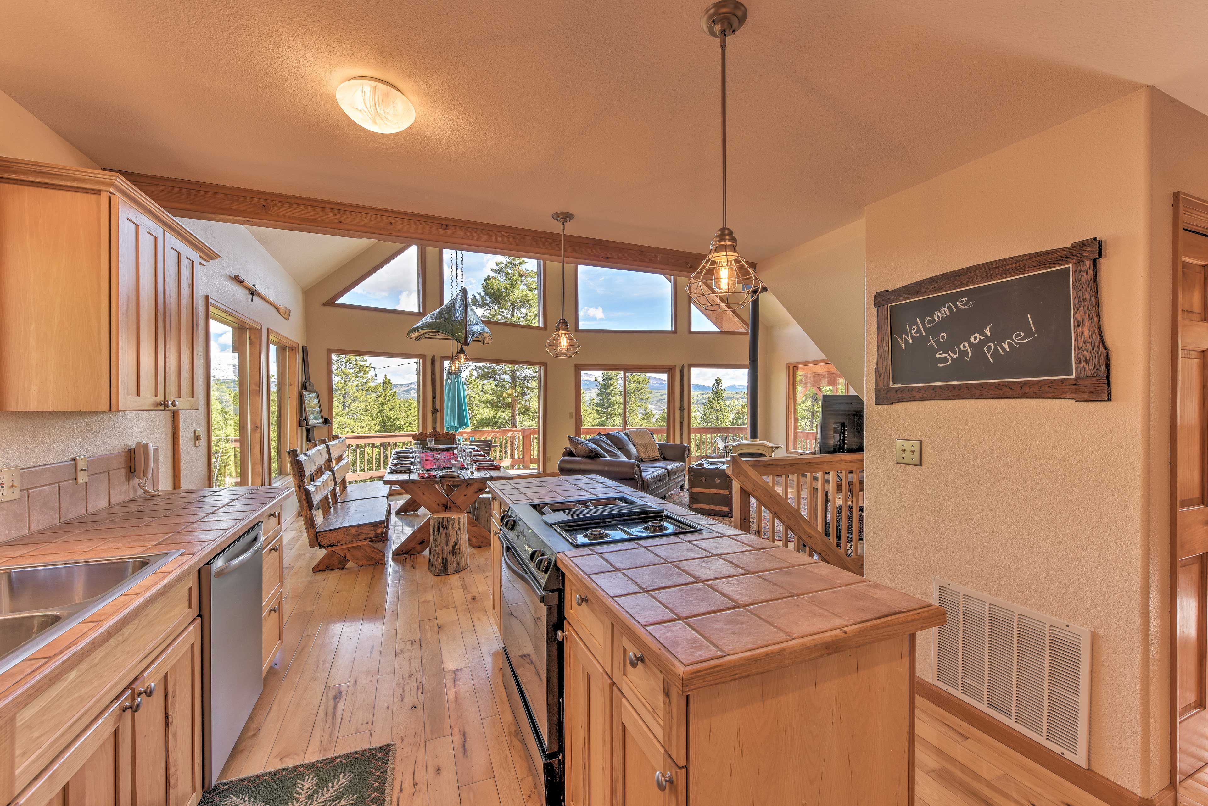 The fully equipped kitchen is located in the back of the open space.