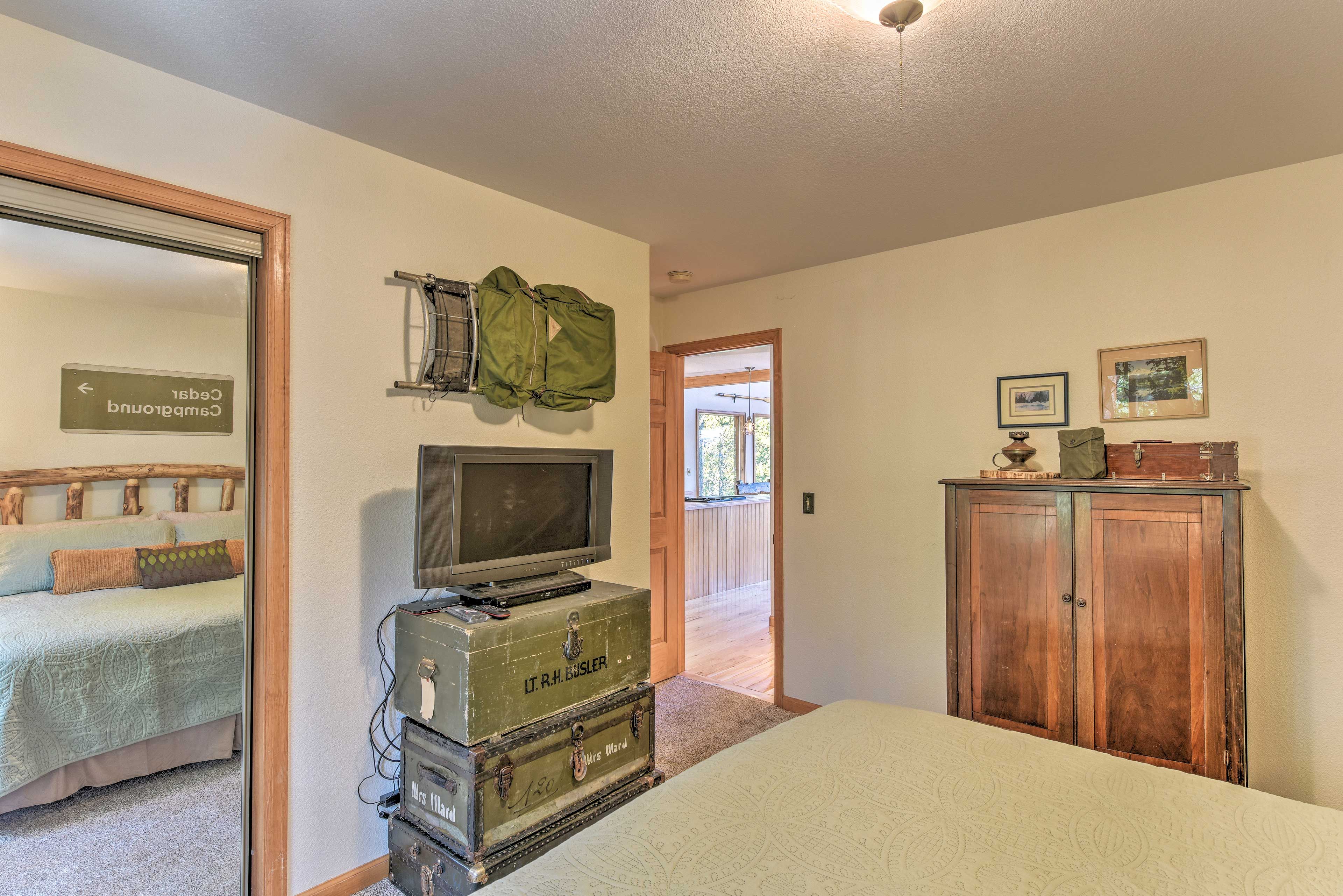 After a day of hiking, relax in bed while watching shows on the flat-screen TV.