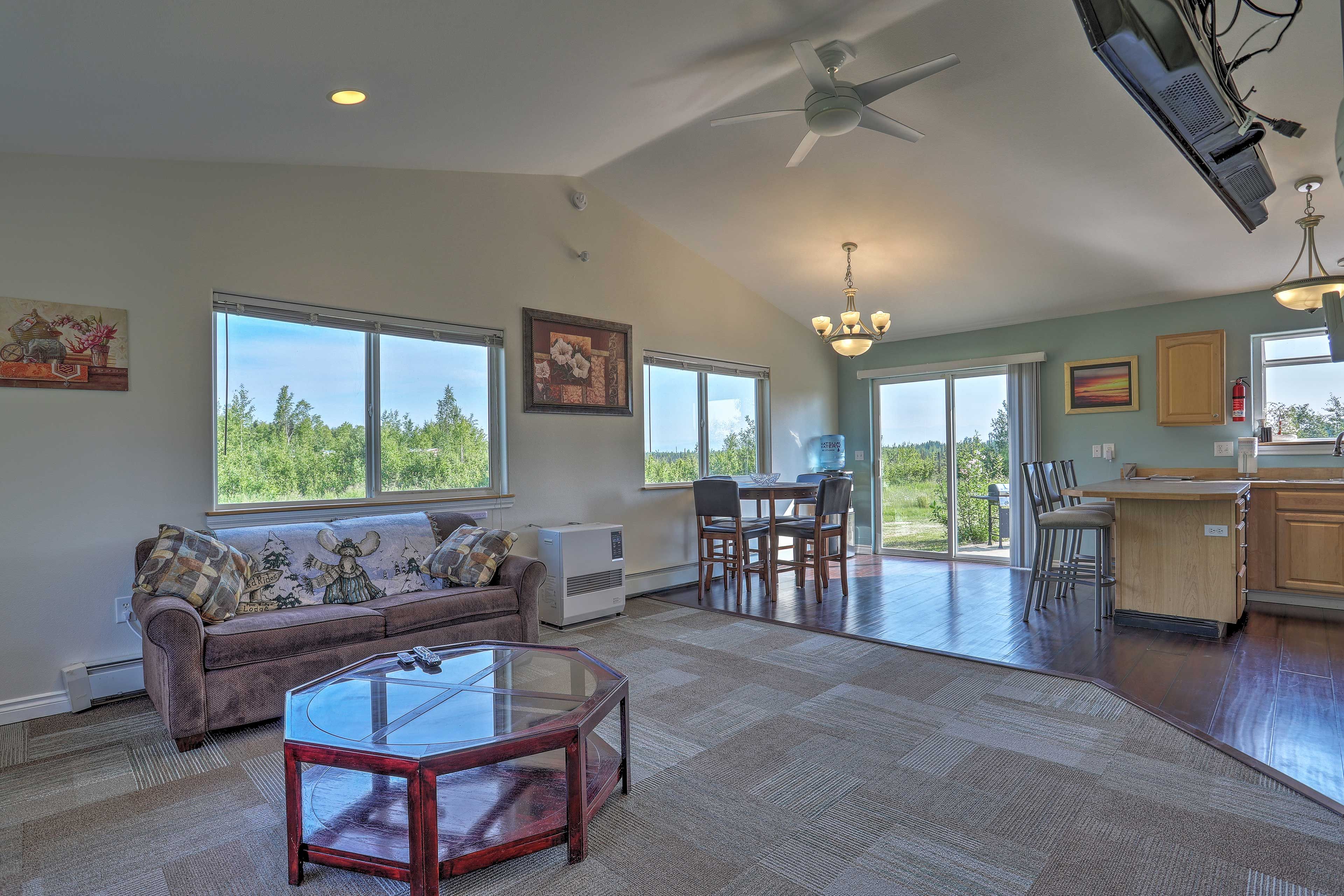 The open floor plan features a flat-screen Smart TV with cable.