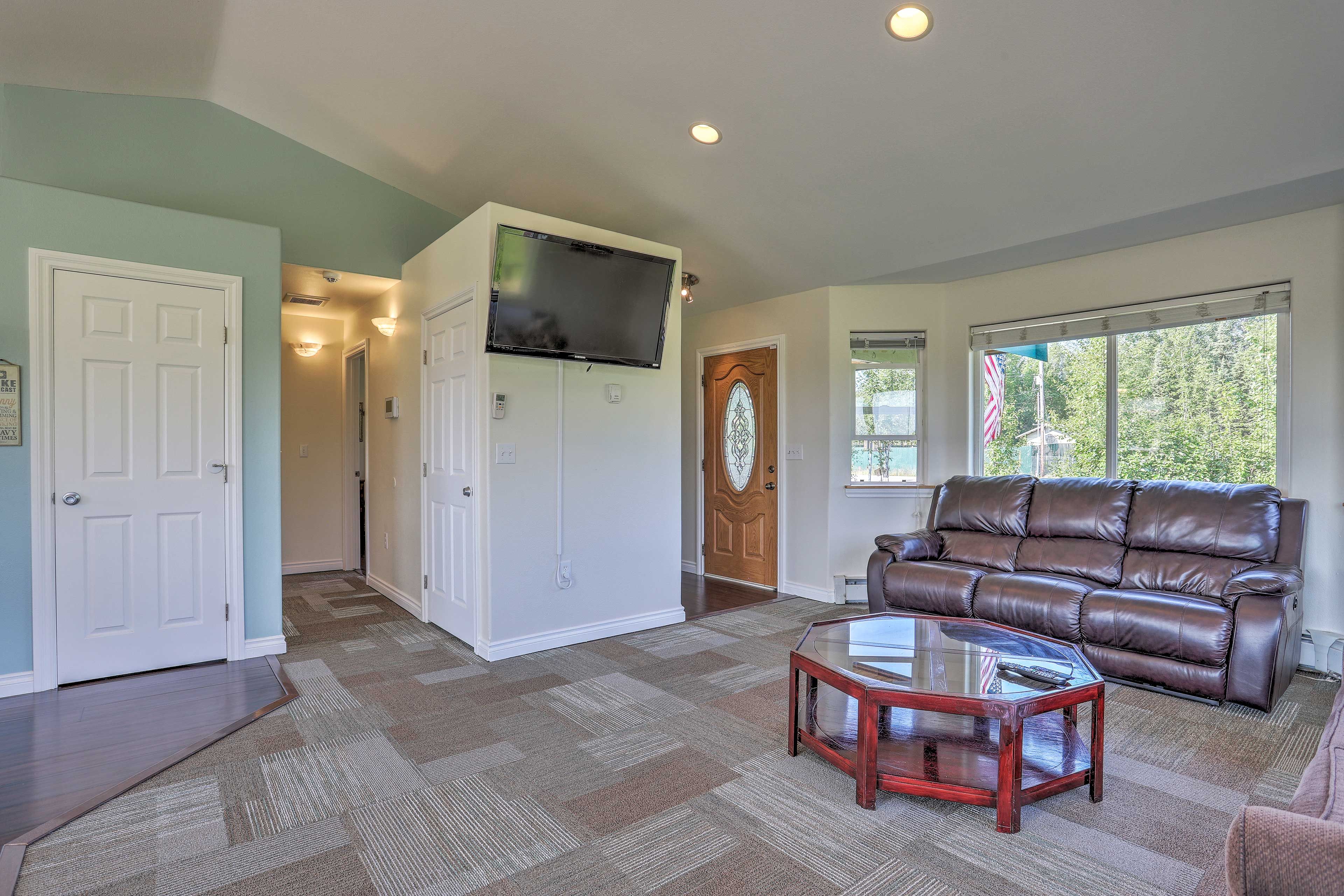 Forest and blue sky views fill the interior.