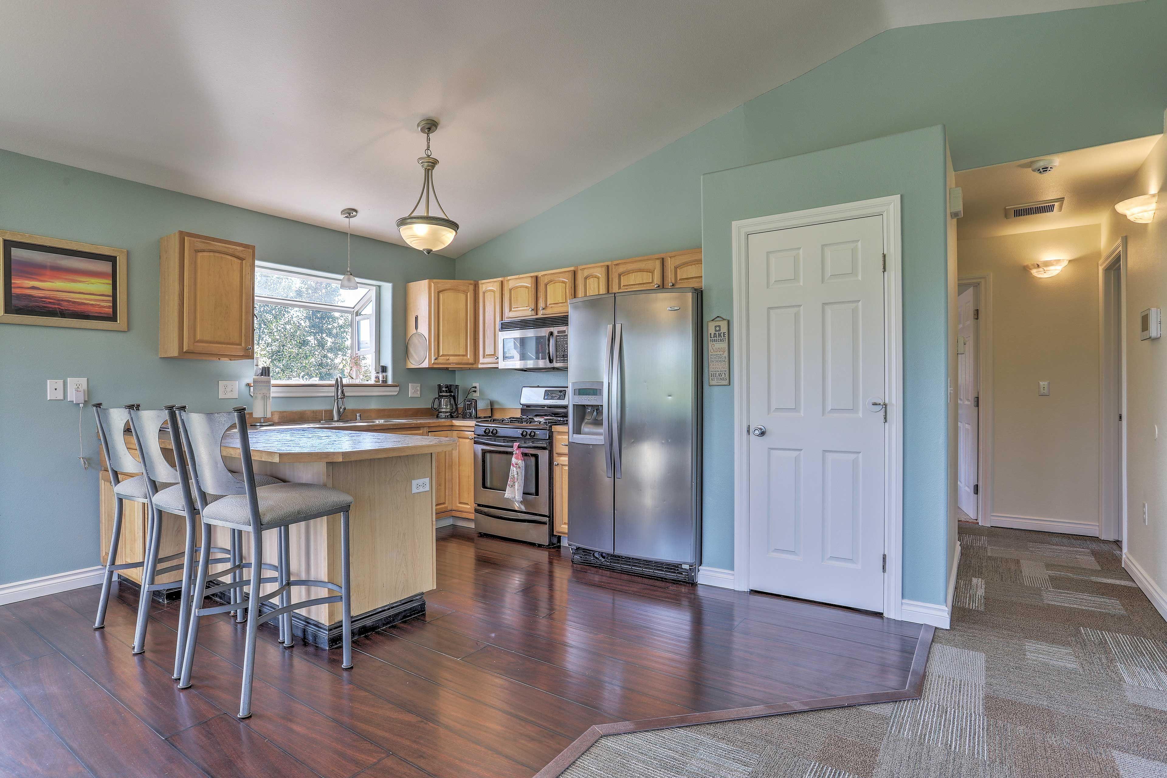 The hardwood floors reflect the natural light.
