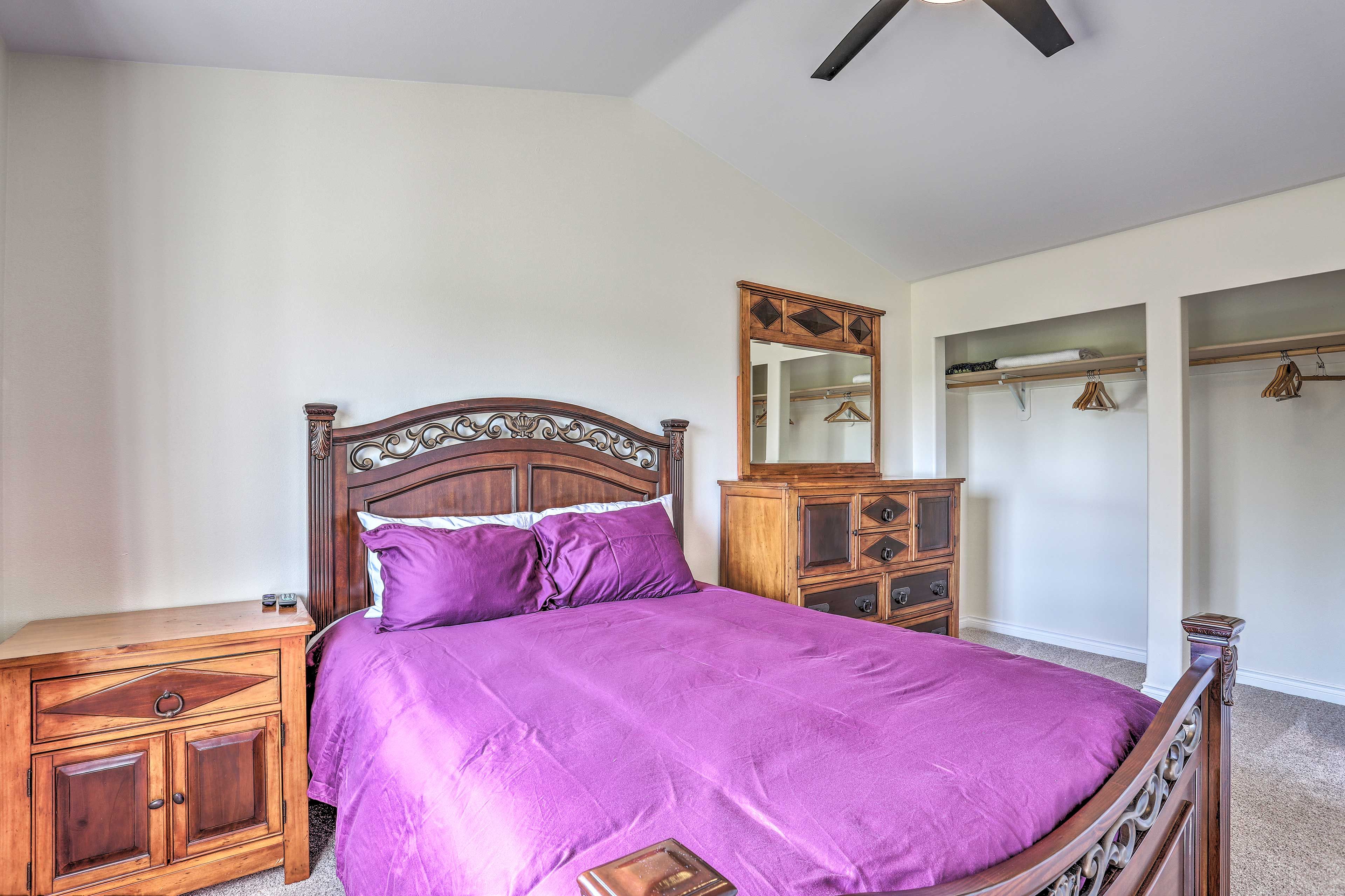 A queen bed furnishes this bedroom.