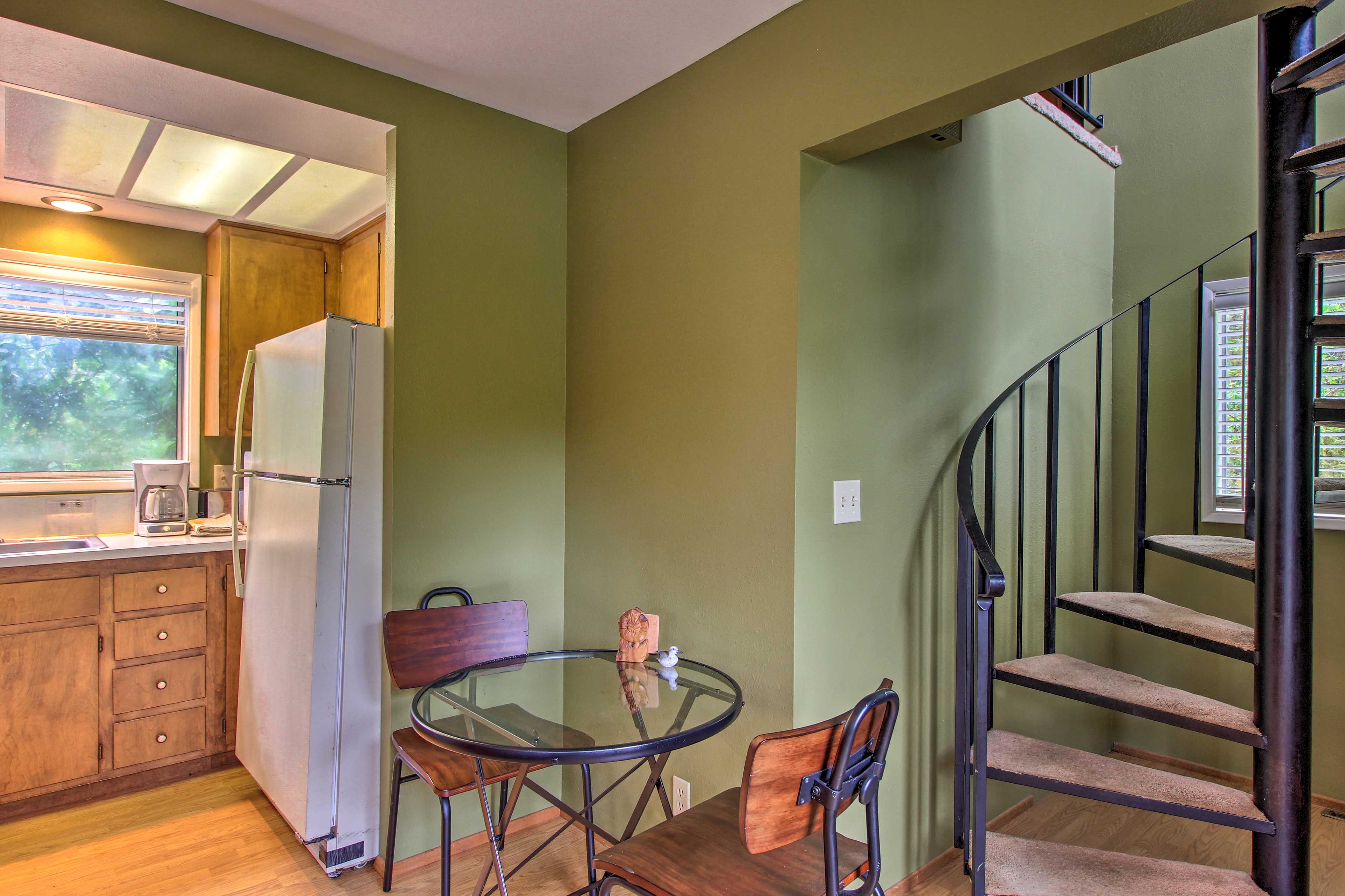 Brew a cup of coffee and enjoy it at this 2-person dining table.