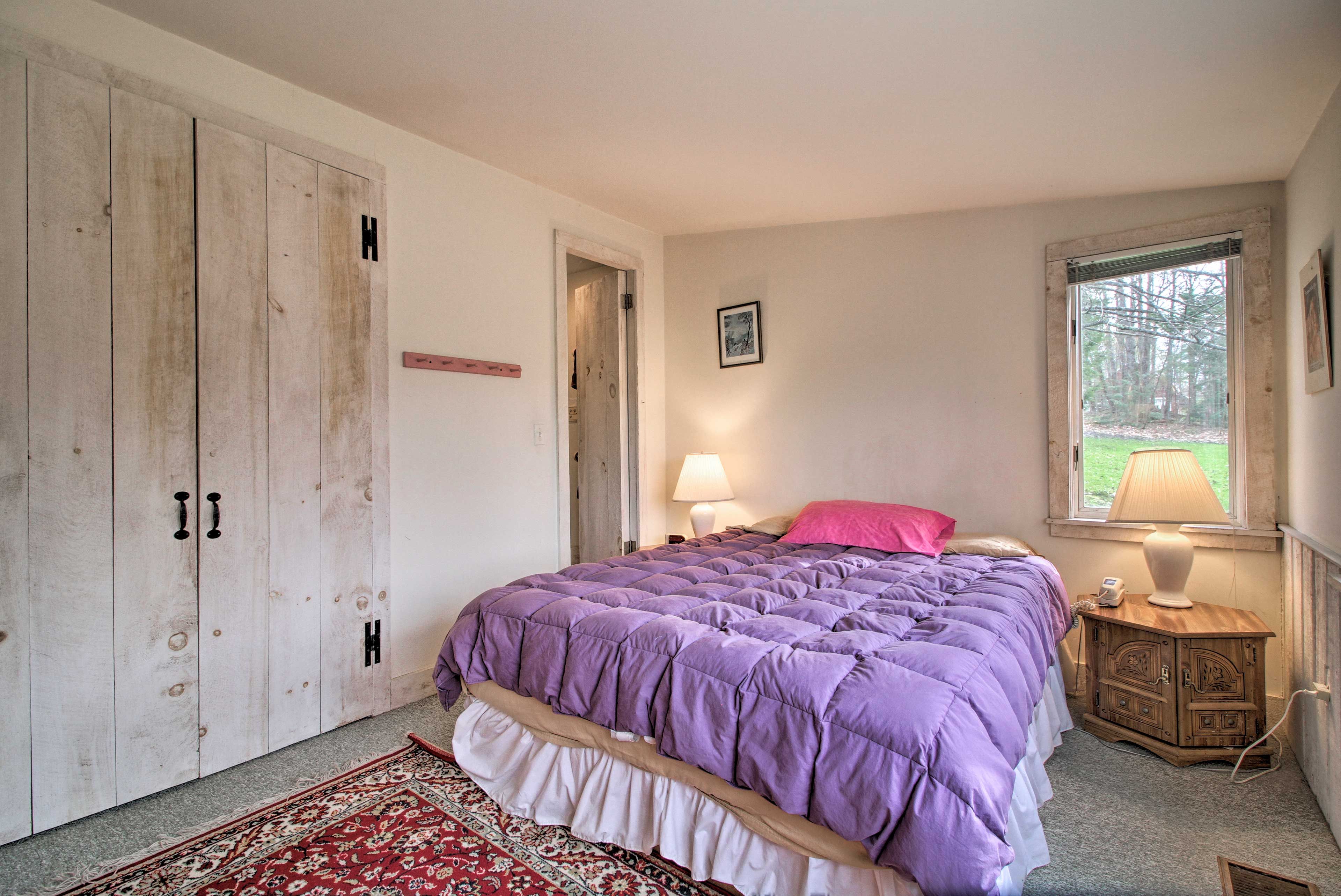 Make yourself at home by unpacking your belongings in the barn-door closet.