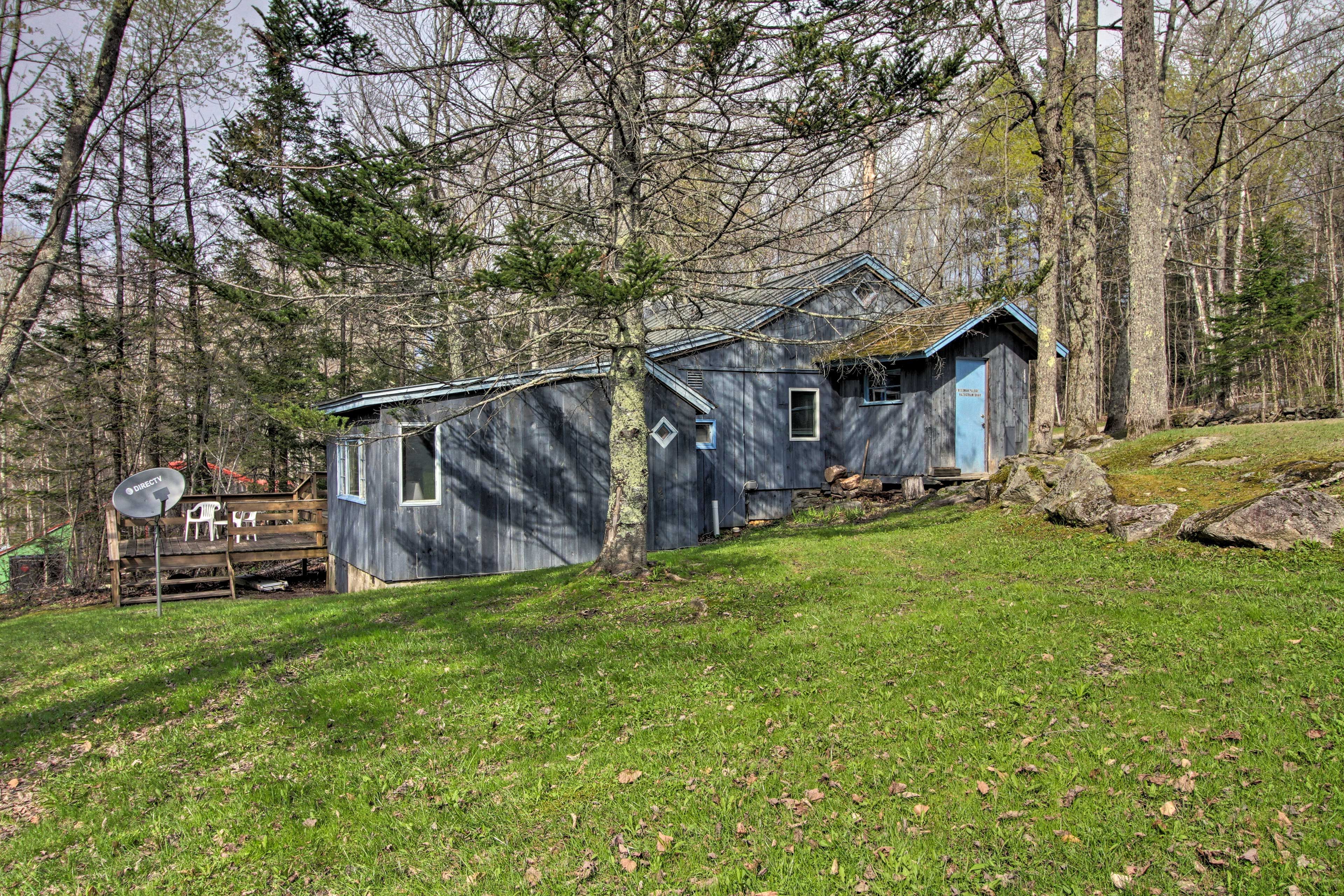 This home is surrounded by a lush national forest.