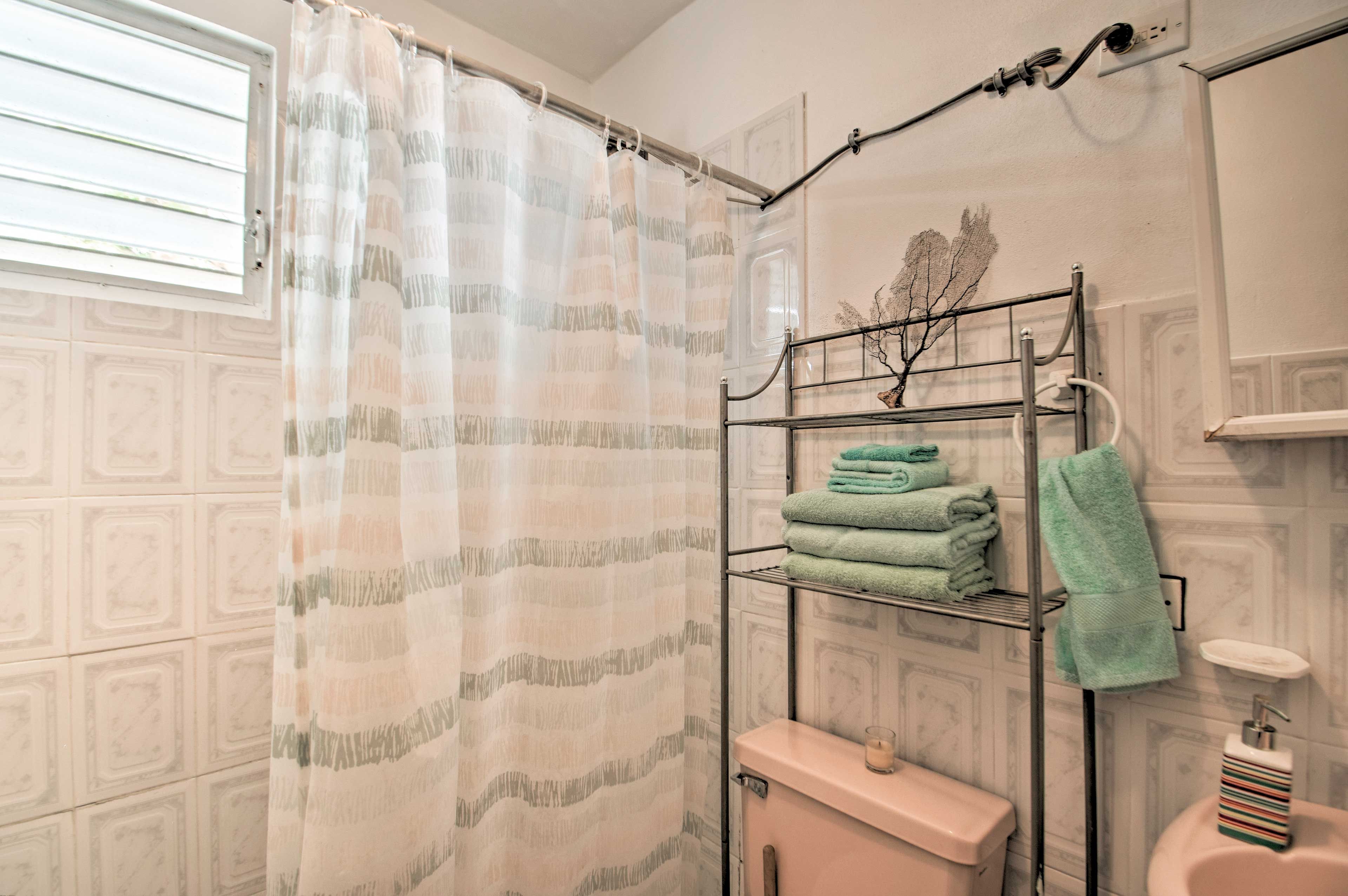 Fresh towels are provided in the full bathroom.