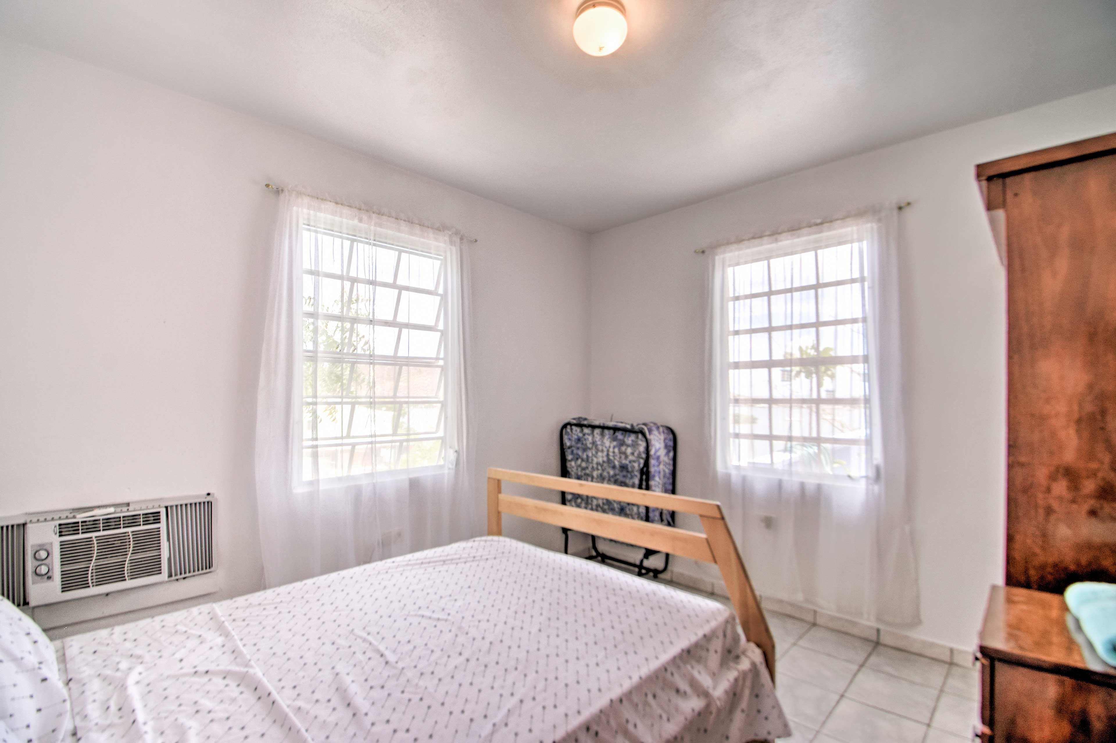 Two guests can share the comfort of this full-sized bed.