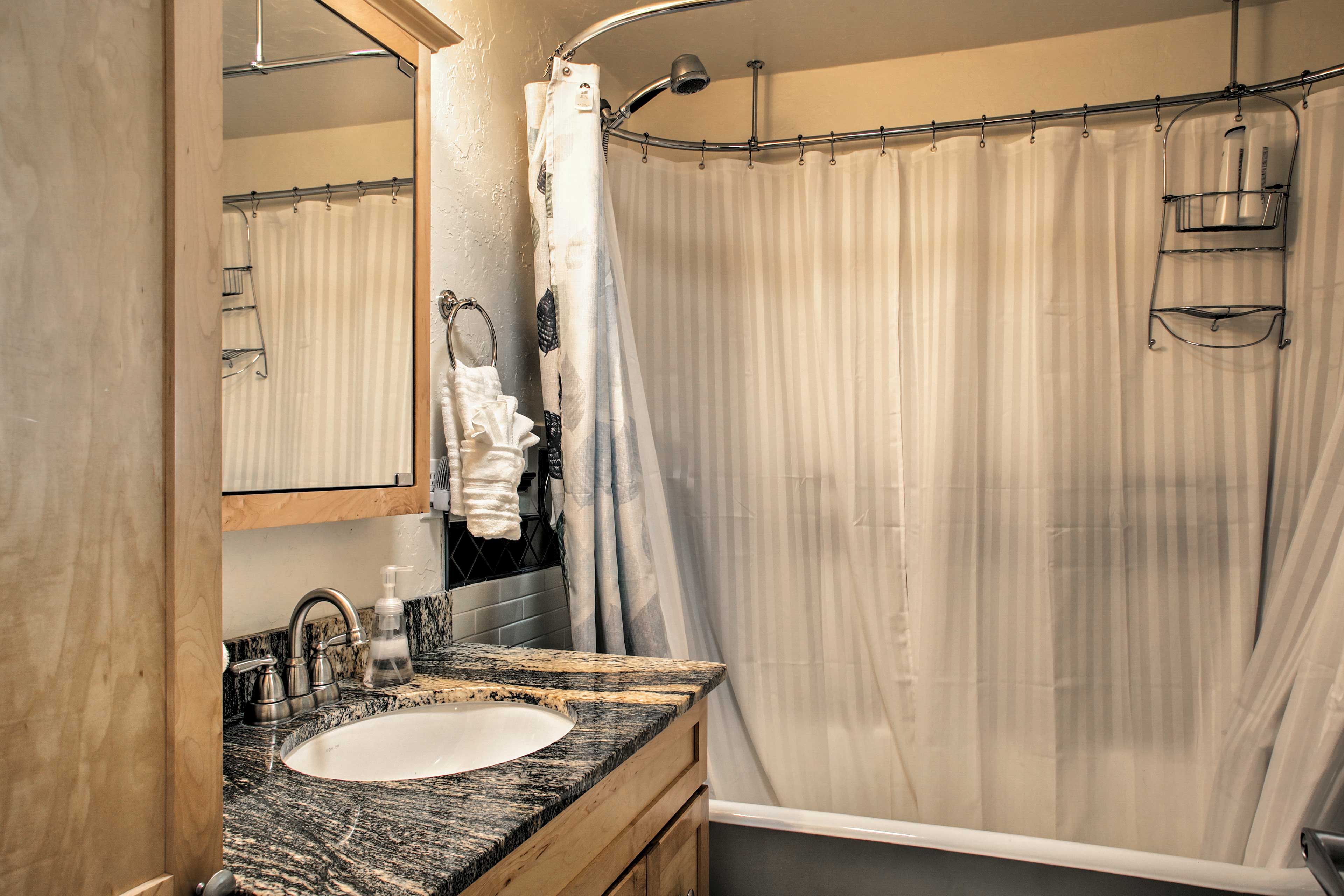 In the bathroom, you will find a claw-foot bathing tub/shower combo.