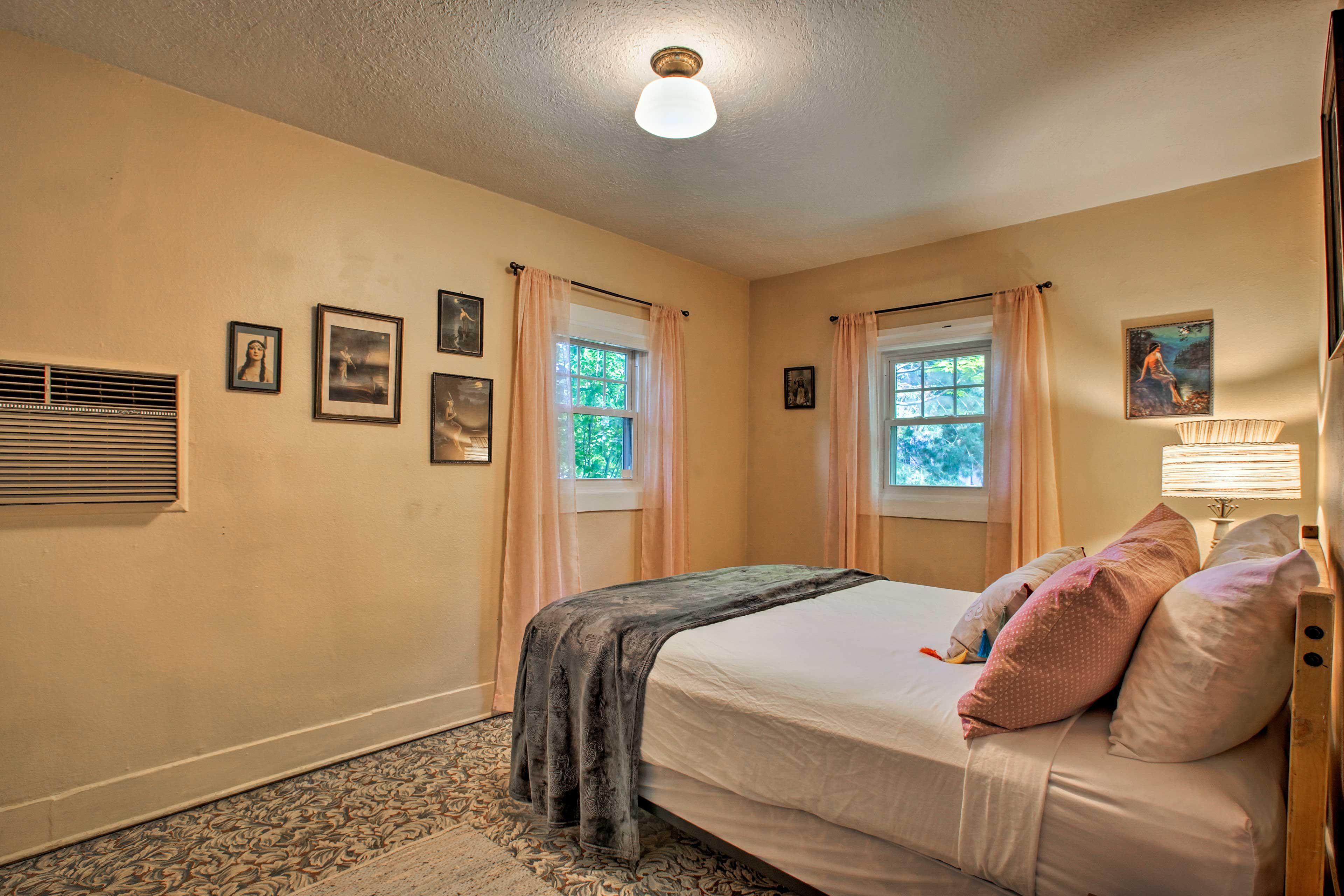 Catch some z's in the queen-sized bed.