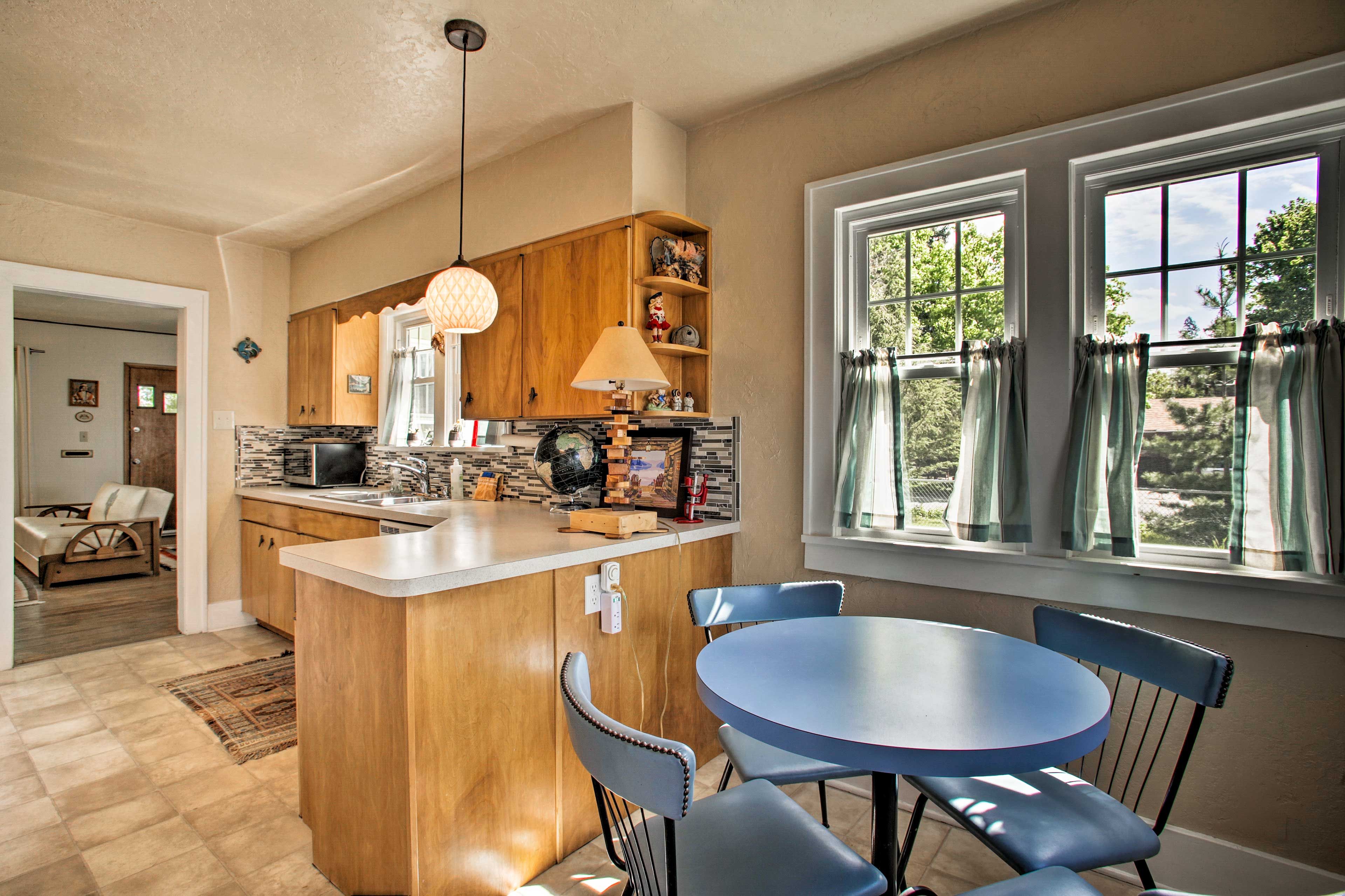 Enjoy a meal together around the 4-person dining table.