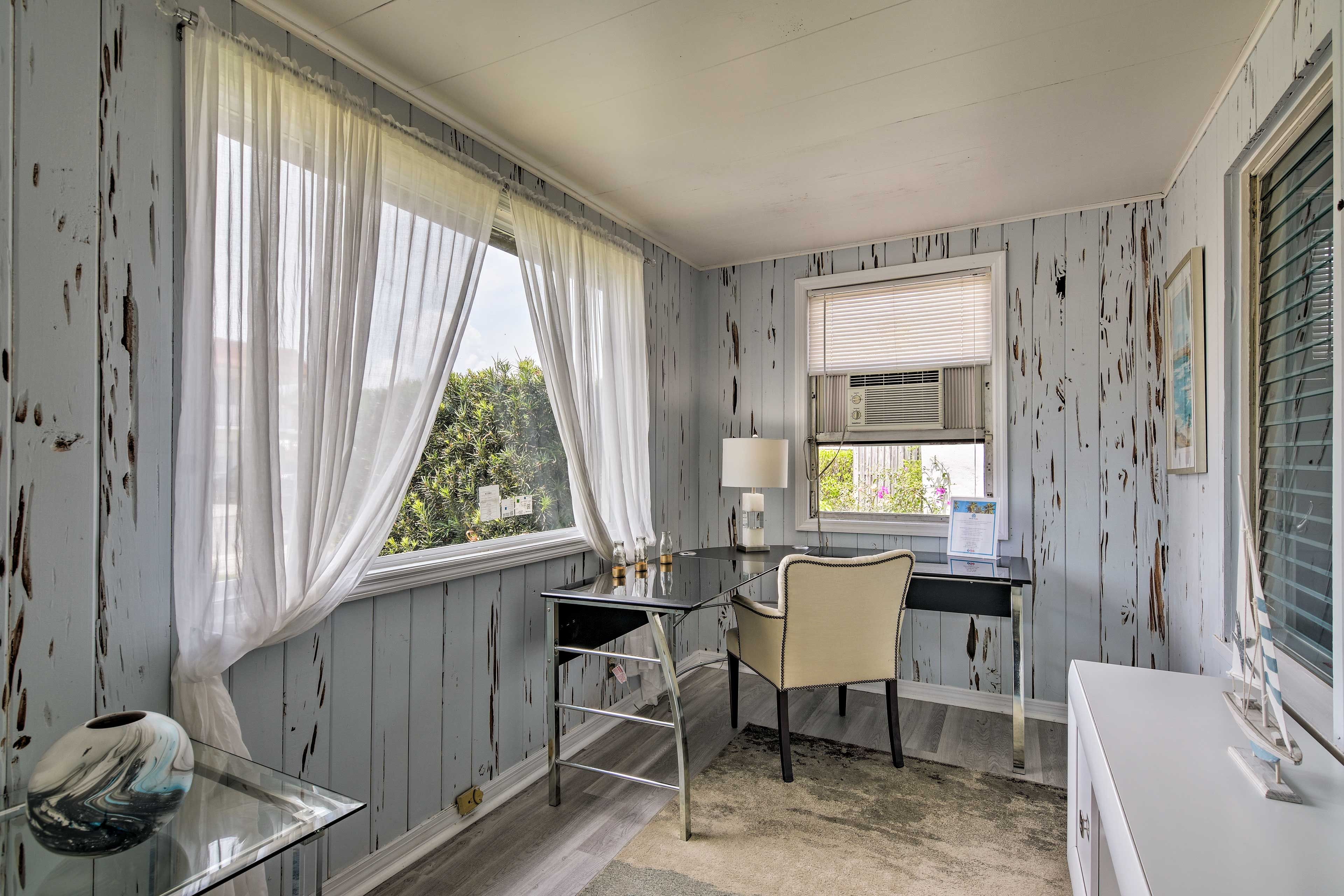 The home features a laptop-friendly workspace.
