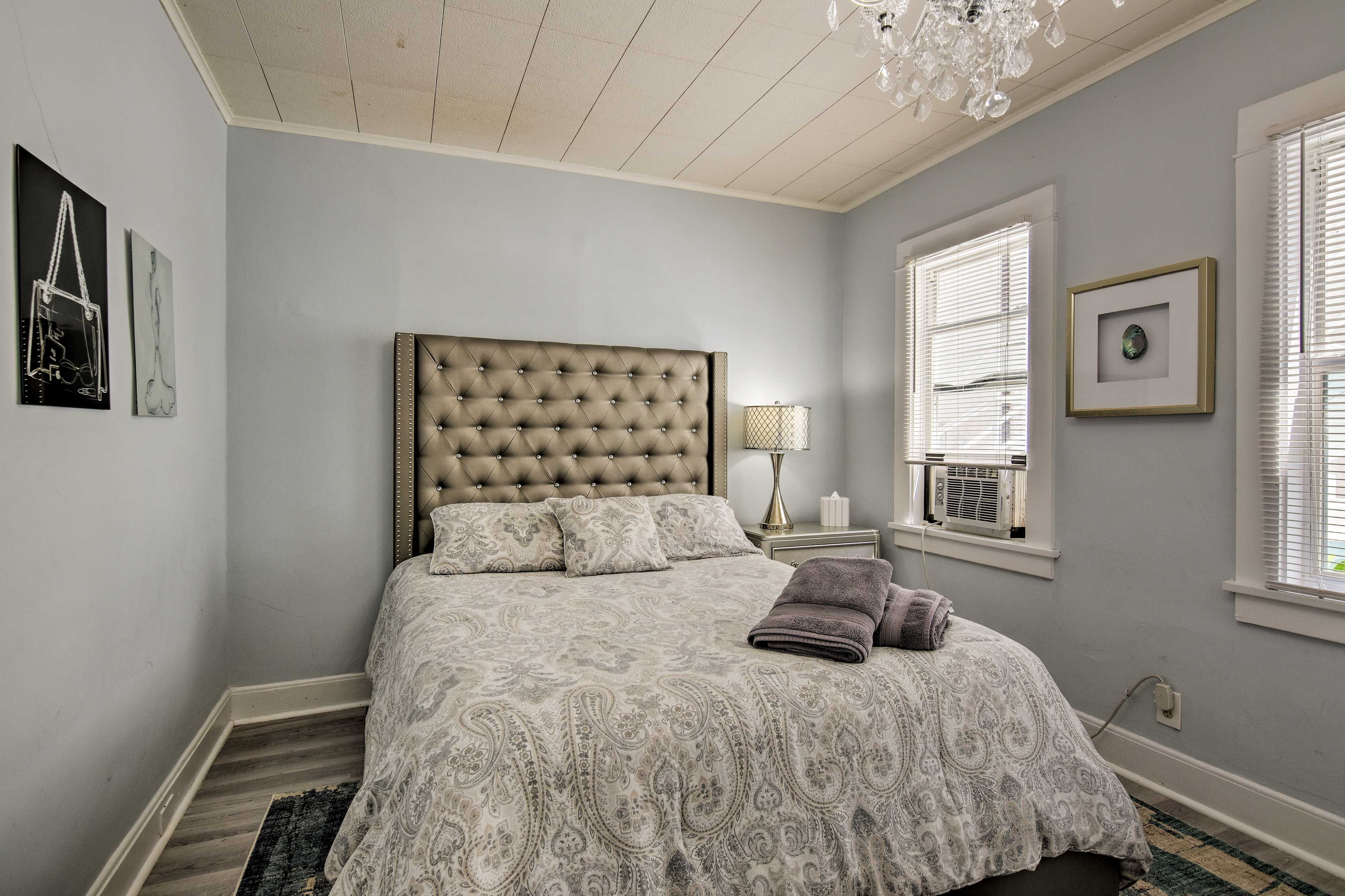 Turn on the window-unit air conditioner to stay cool!