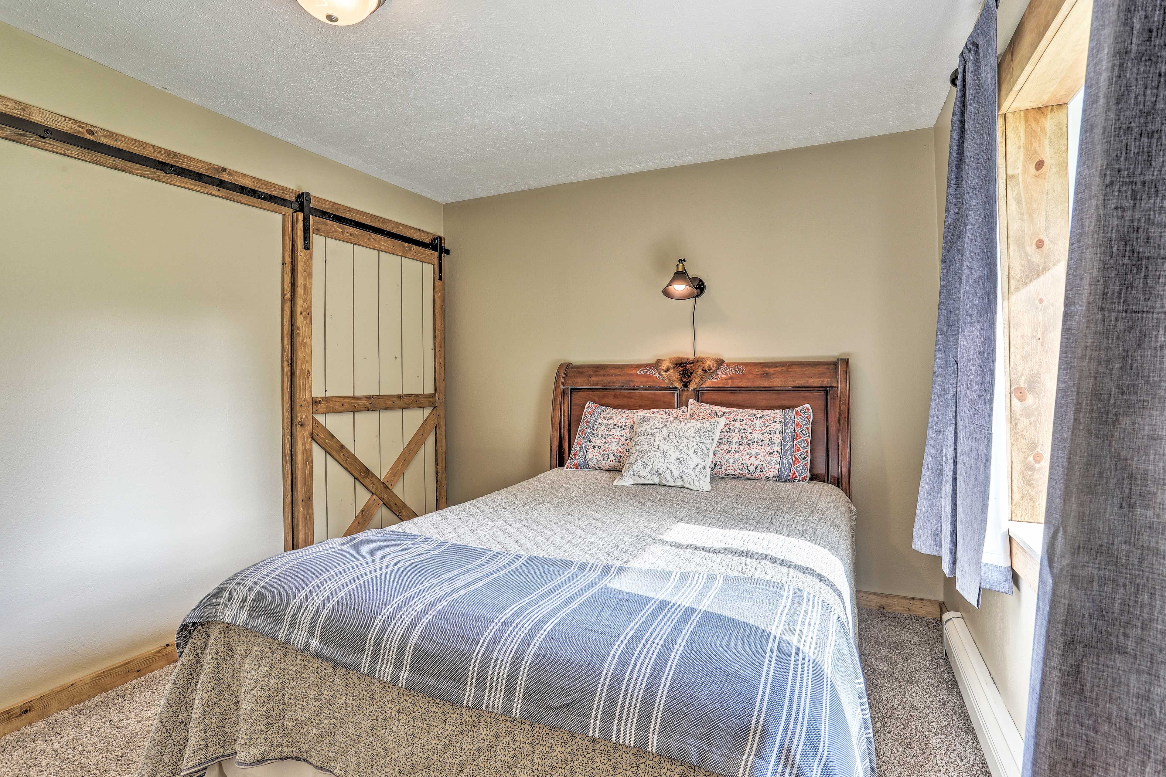 Rest easy on the queen bed furnishings this bedroom.