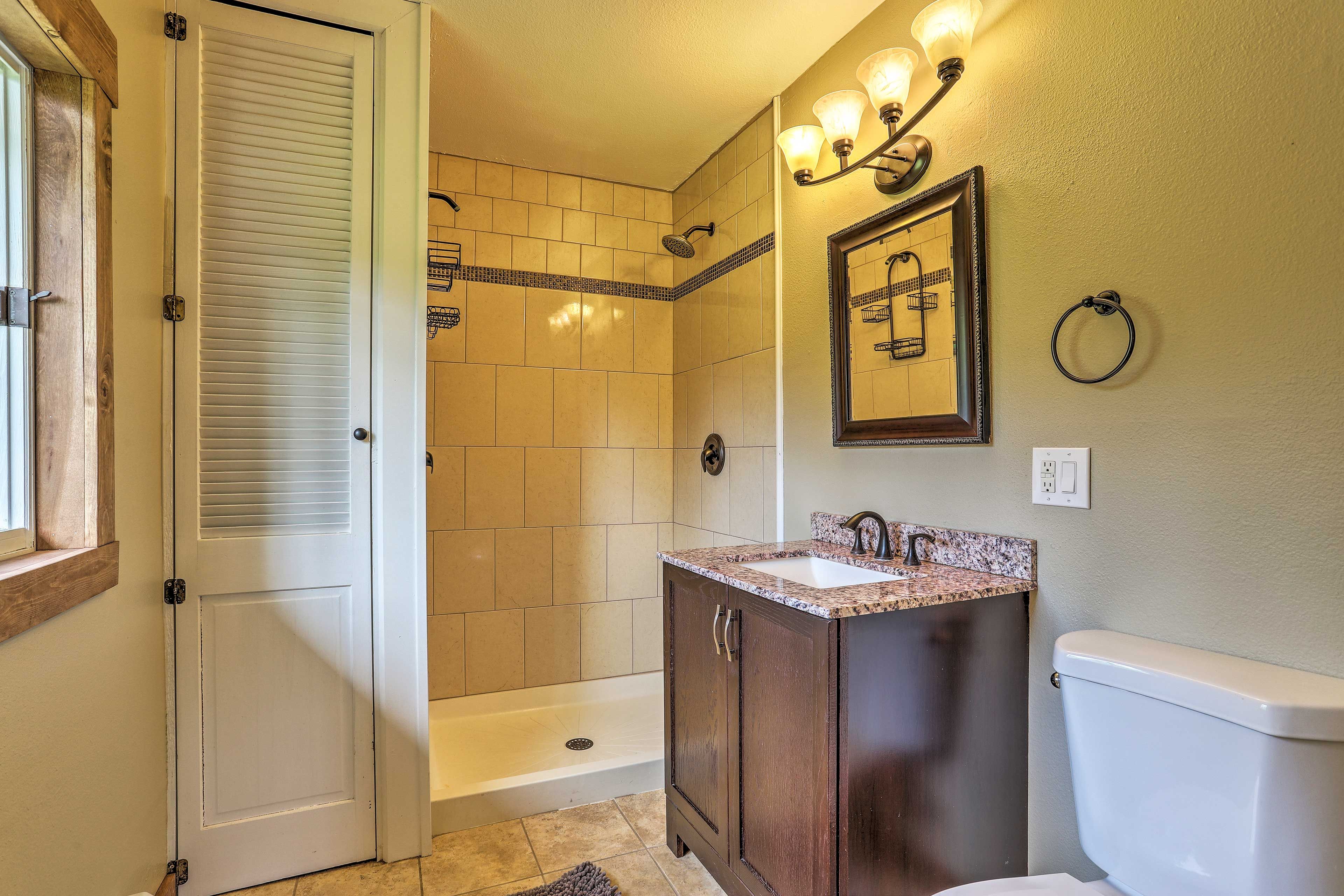 The second bathroom features floor-to-ceiling tile in the spacious shower!
