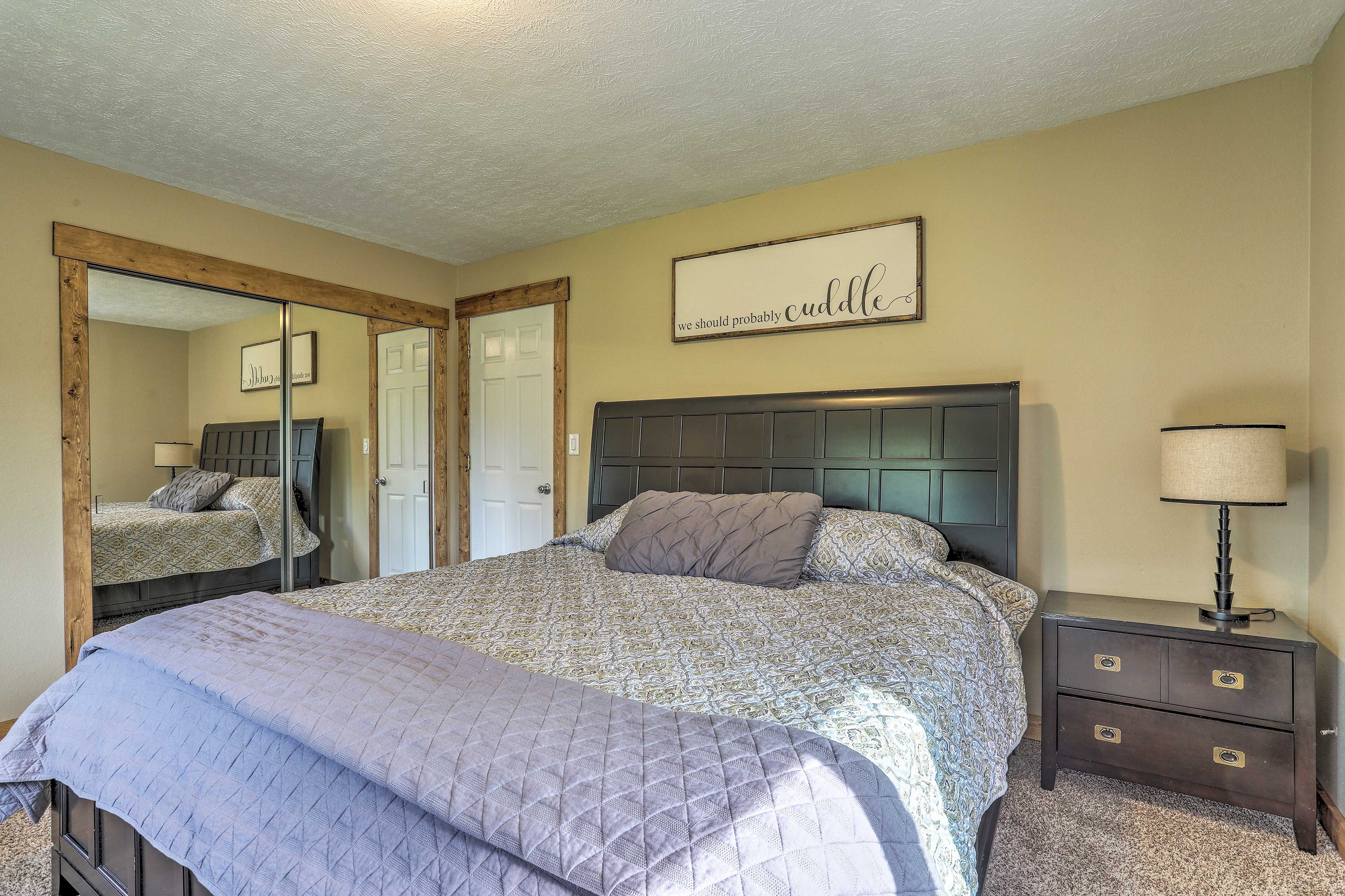 This chic bedroom boasts a full bed.