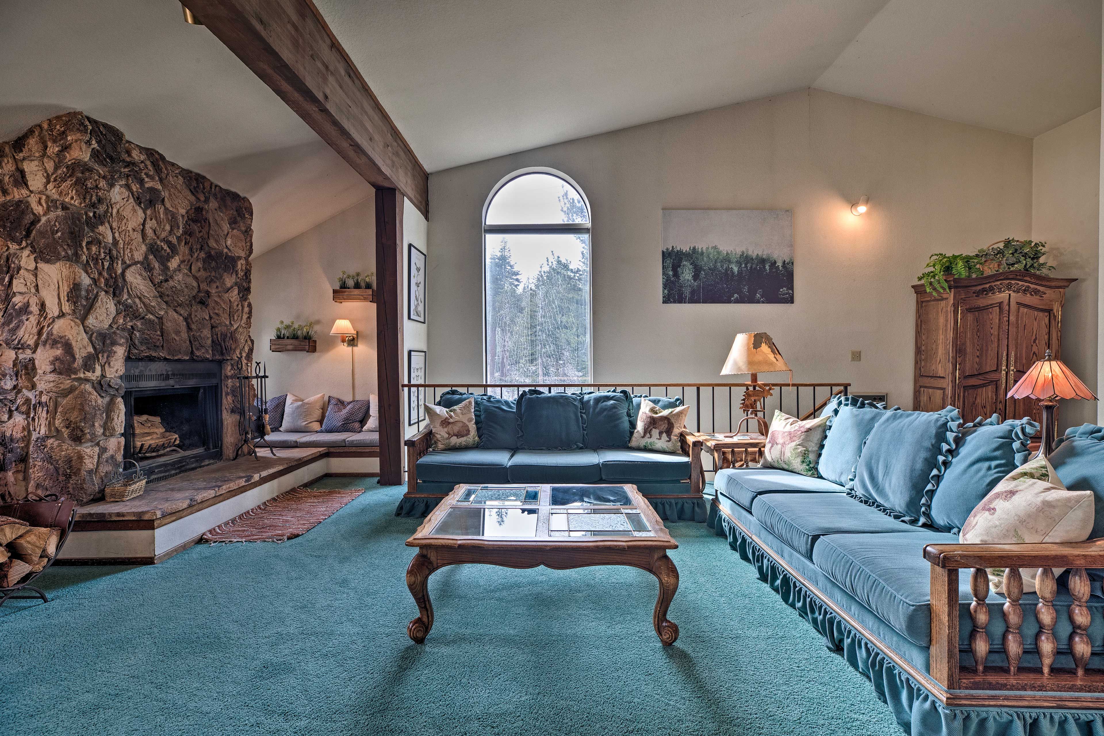 Lounge on the couch and enjoy the warmth of the wood-burning fireplace.