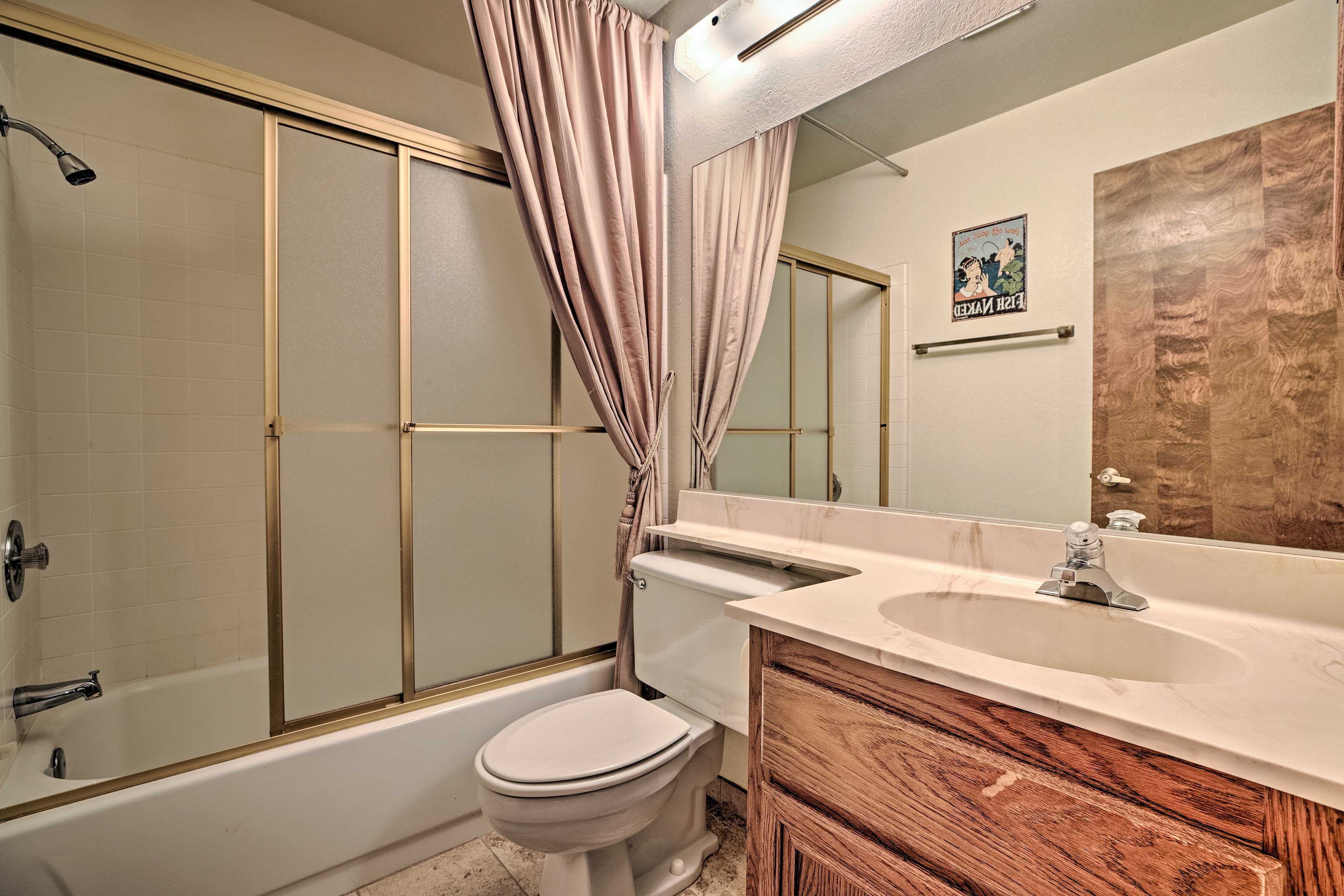 Rinse off the day in the shower/tub combo.