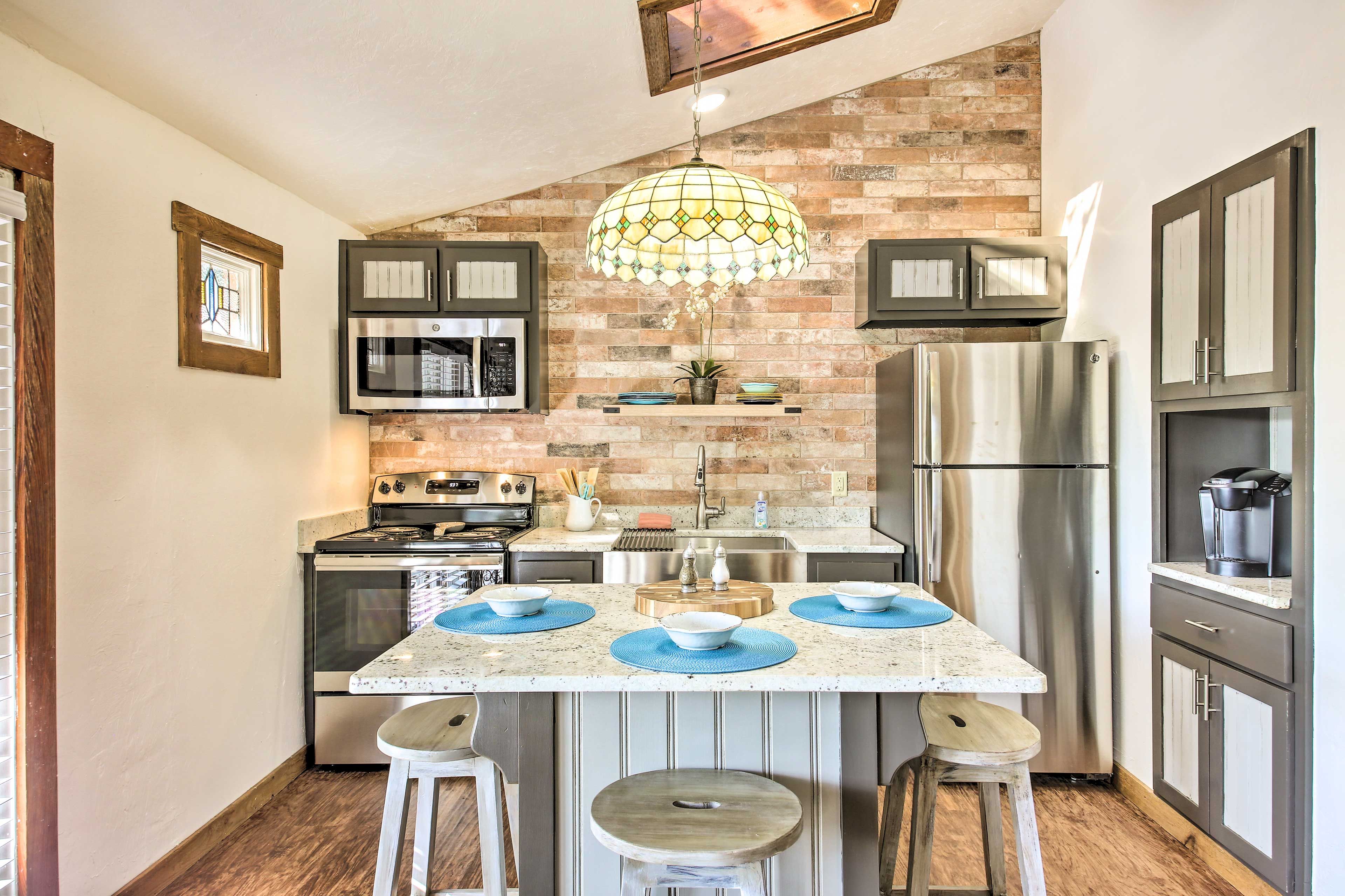 The modern kitchen boasts a 3-person island.