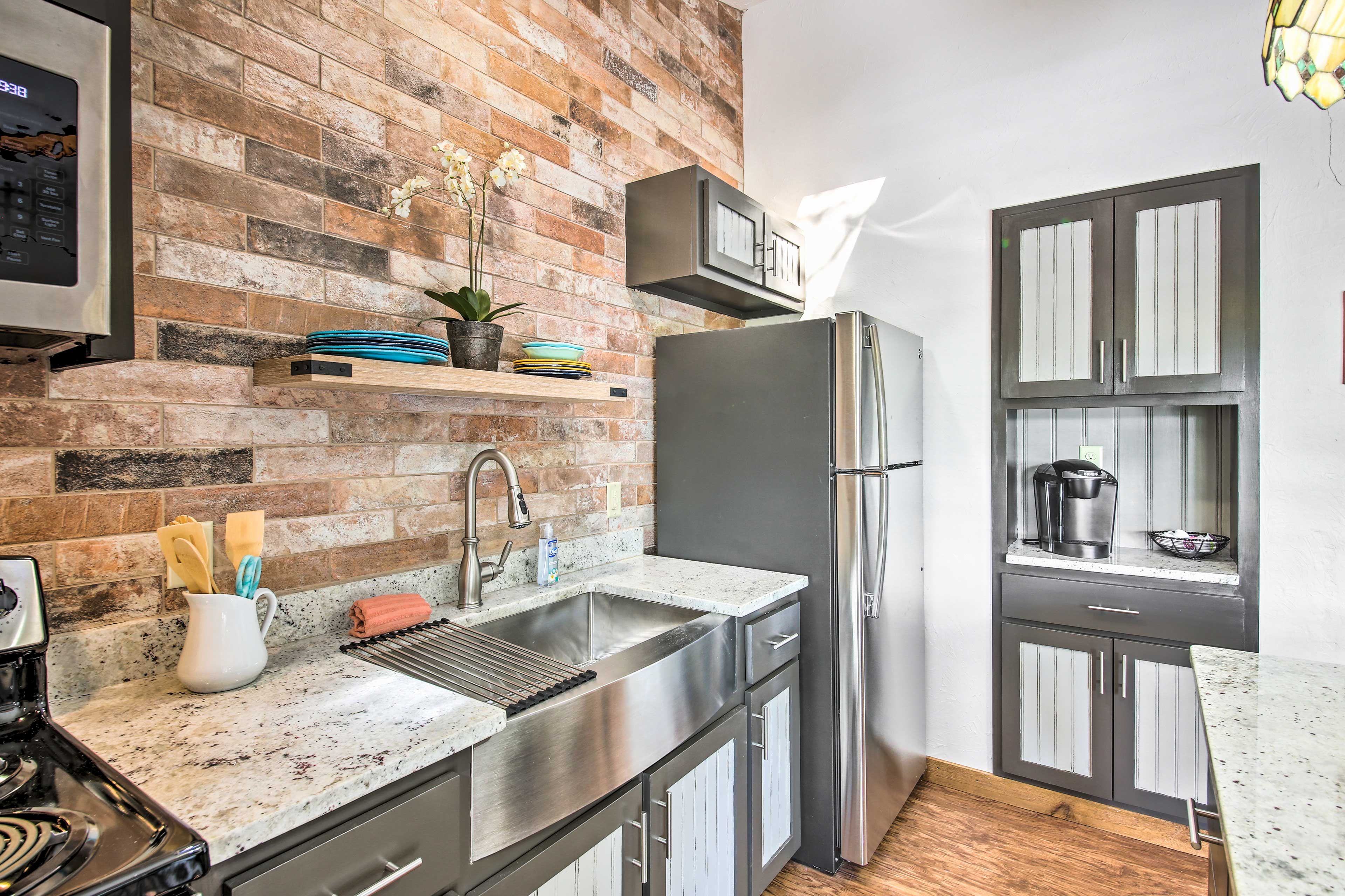 The kitchen boasts stainless steel appliances and a large kitchen sink.