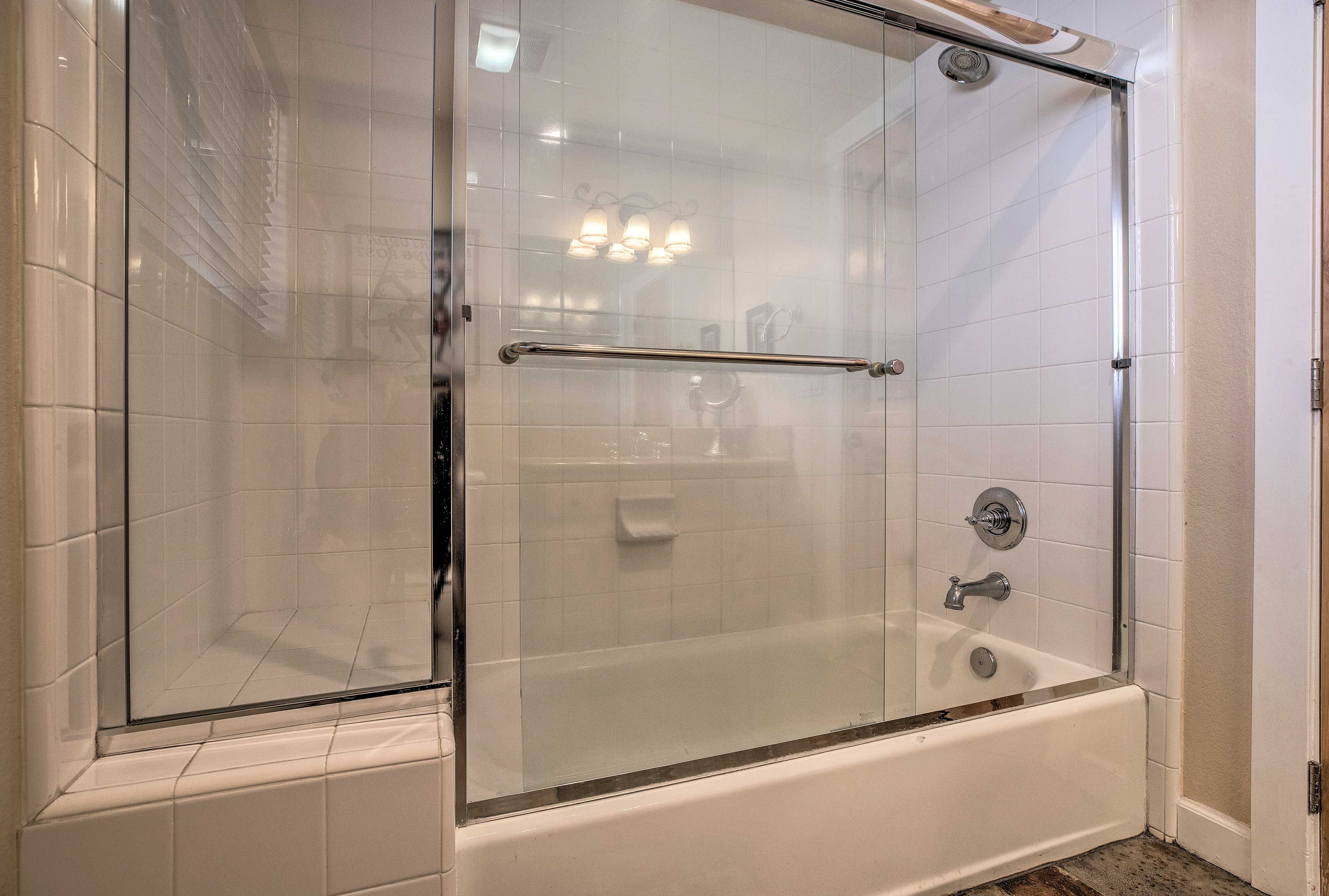 Wash up in this spacious shower/tub combo with a sliding glass door.