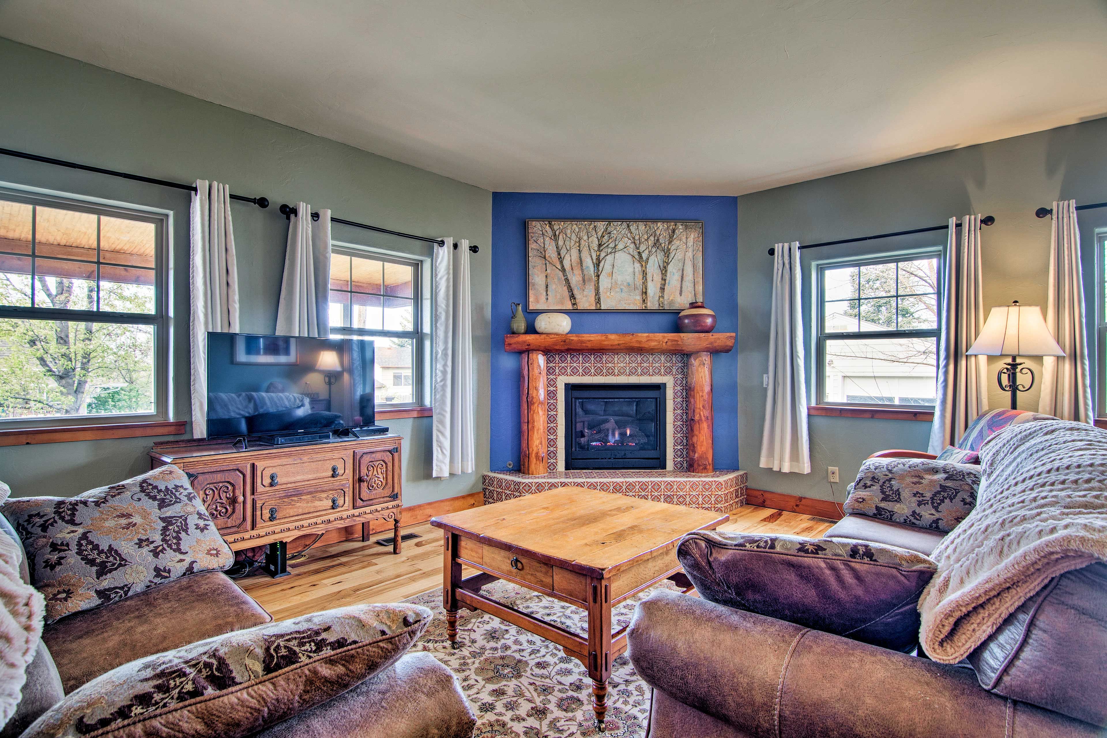 Warm up by the gas fireplace while a movie plays on the flat-screen TV.