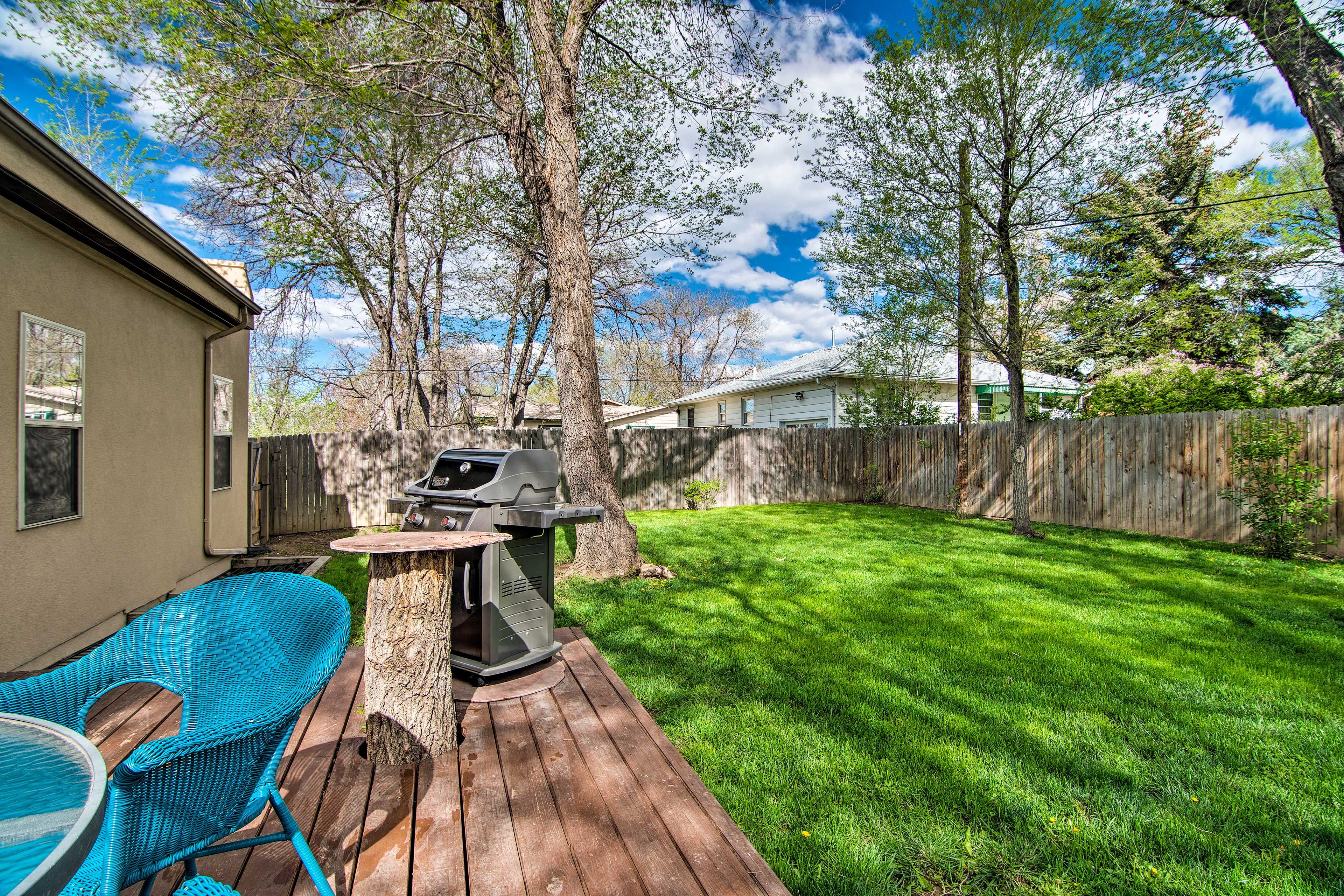 The backyard features a patio, 4-person table, and gas grill.