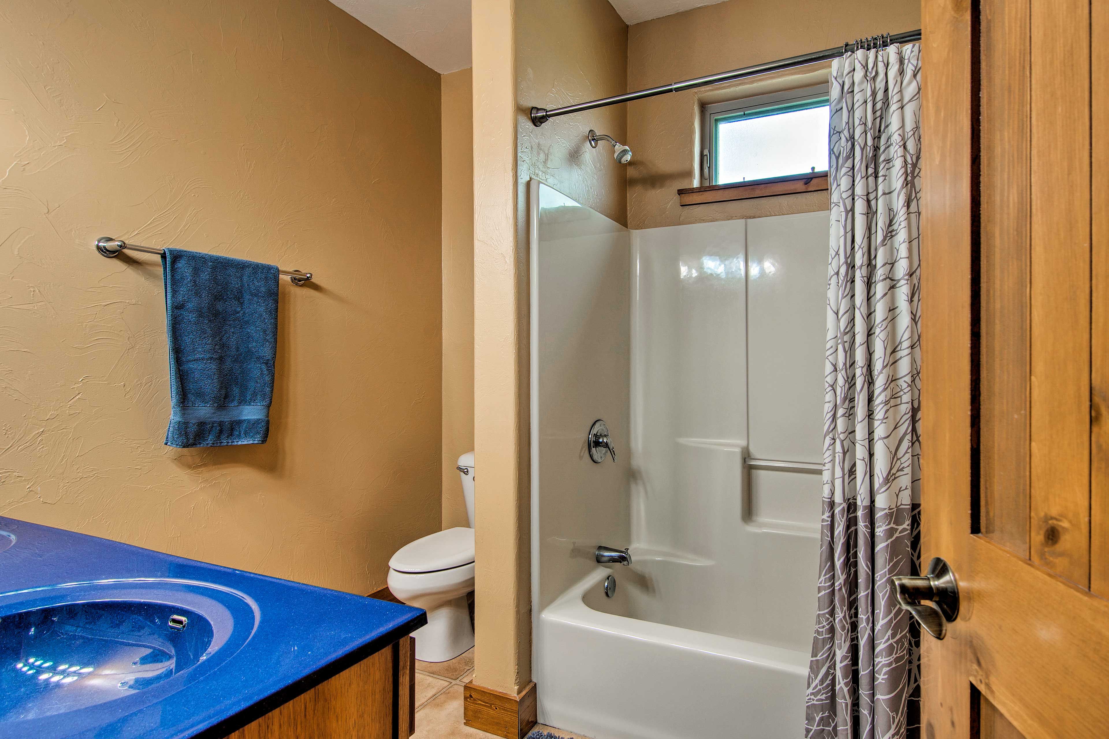 Rinse off in the shower/tub combo found in the second full bathroom.